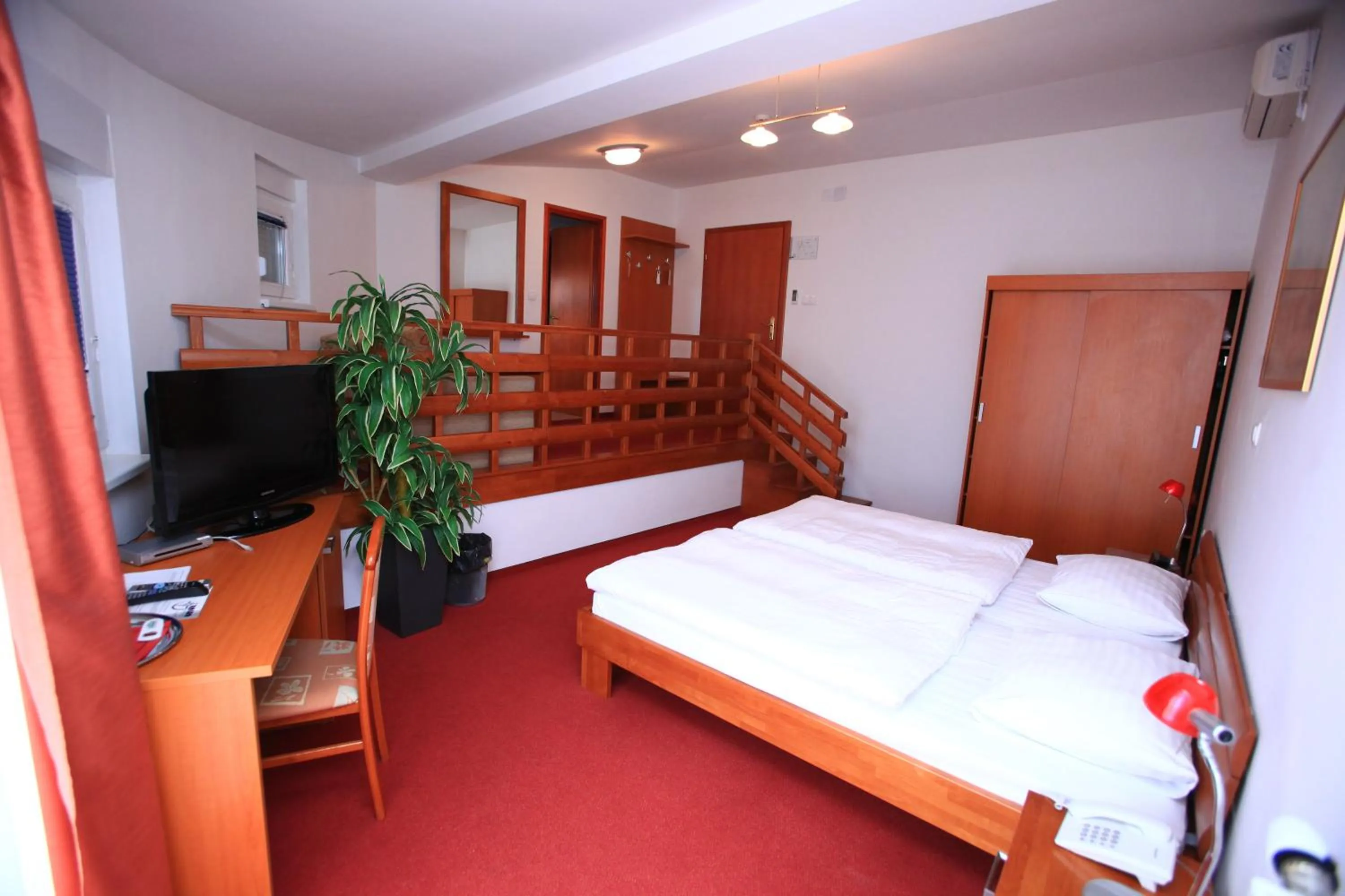 Toilet, Bed in Hotel Orion