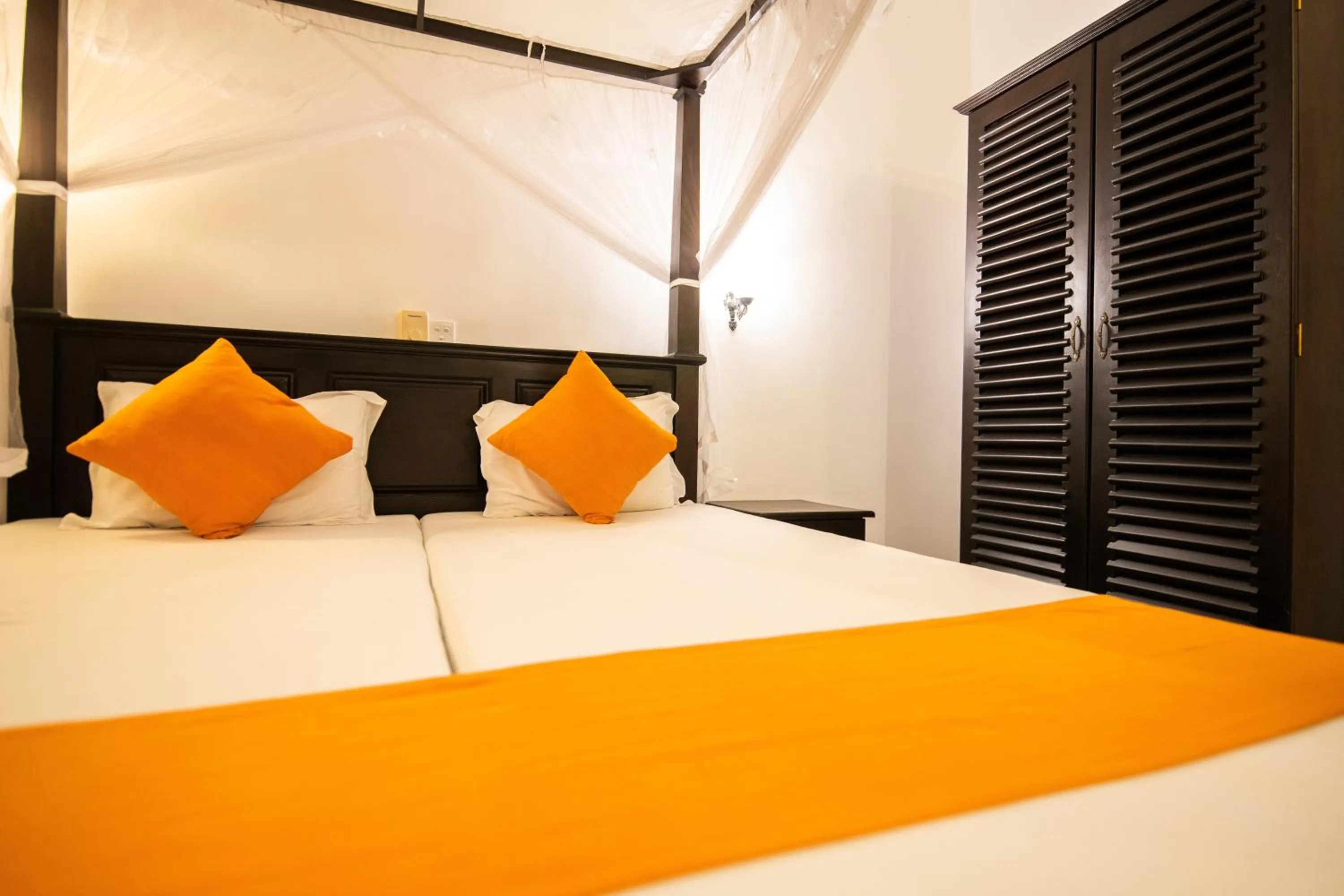 Bed in International Beach Hotel & Restaurant