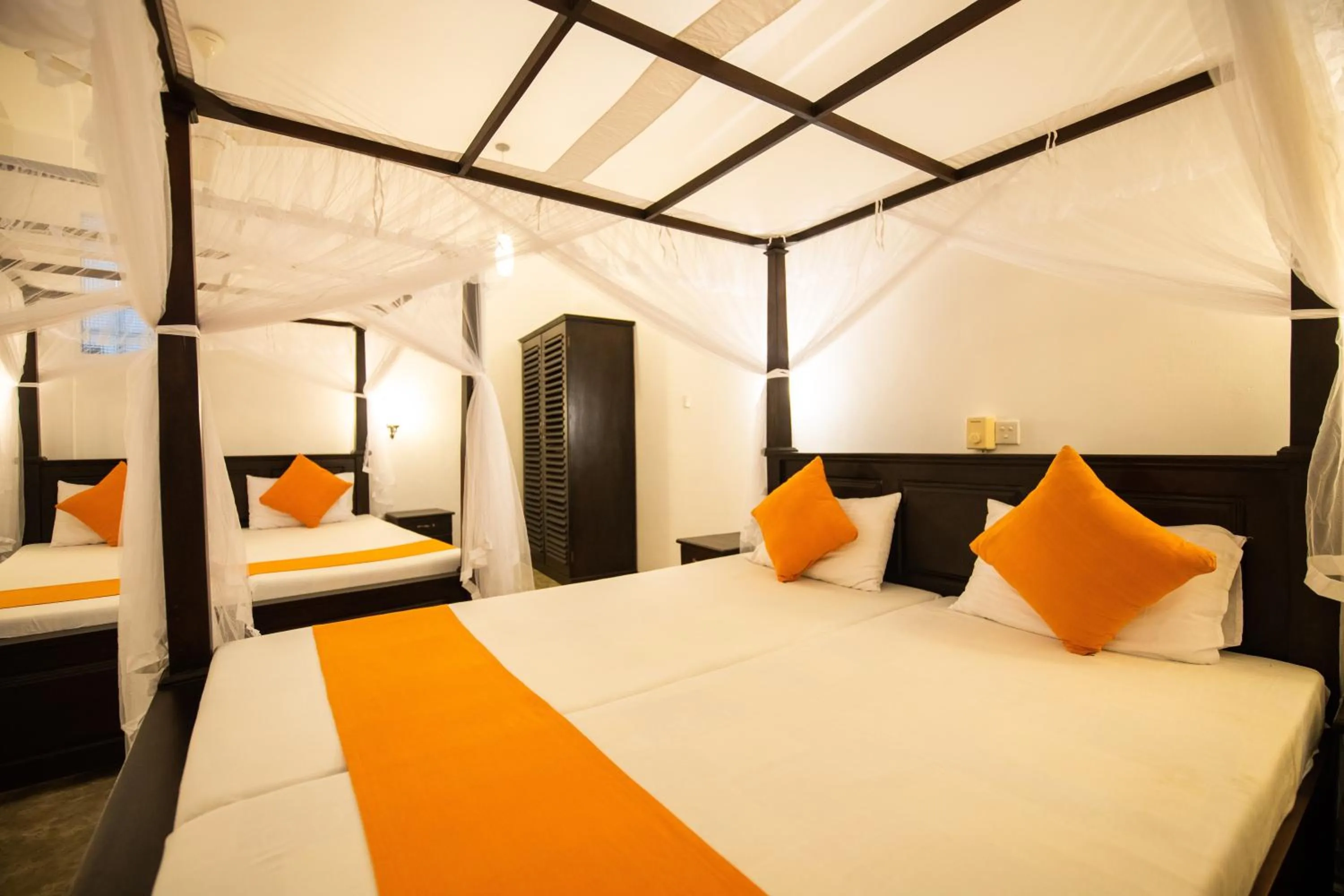 Bed in International Beach Hotel & Restaurant