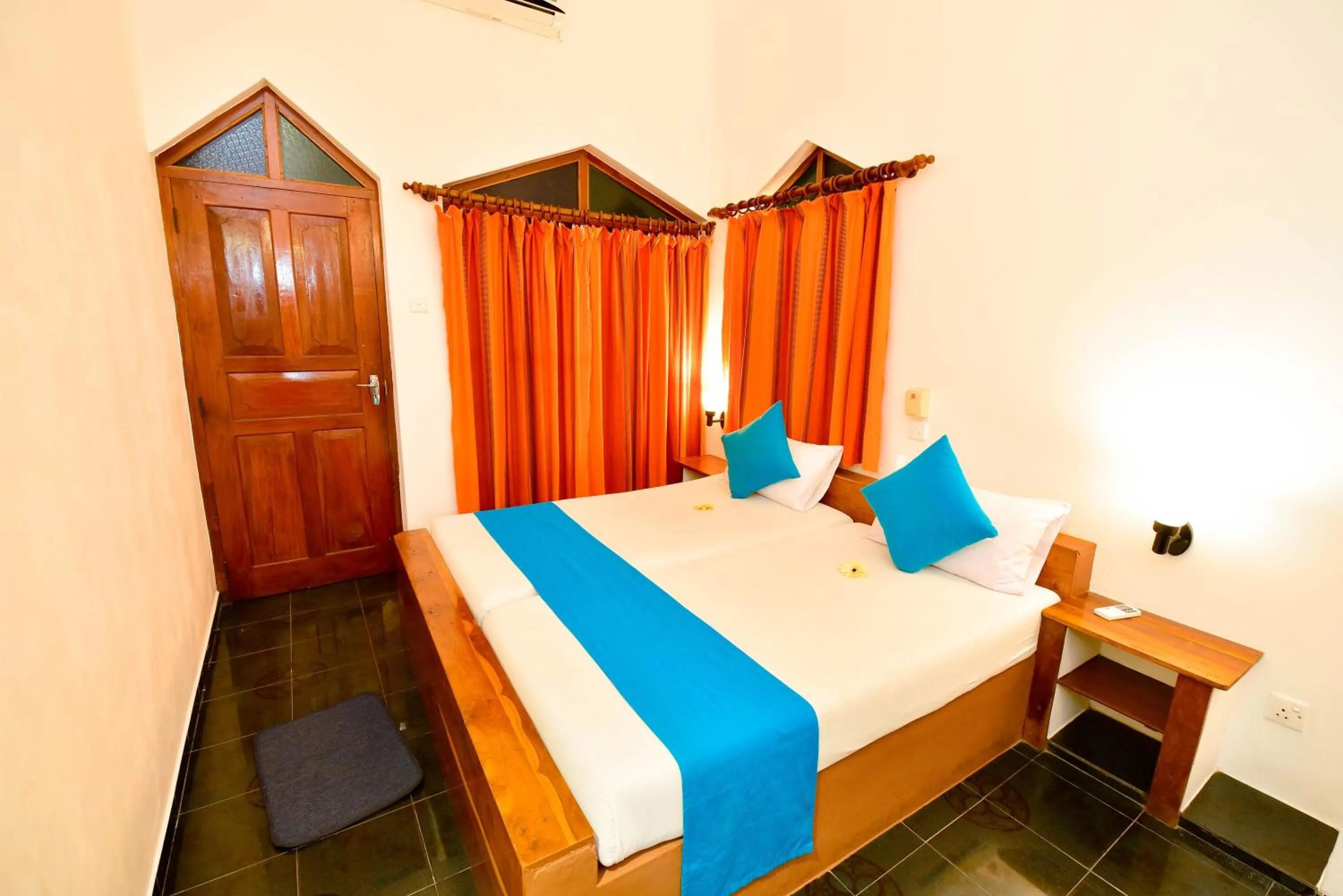 Bed in International Beach Hotel & Restaurant