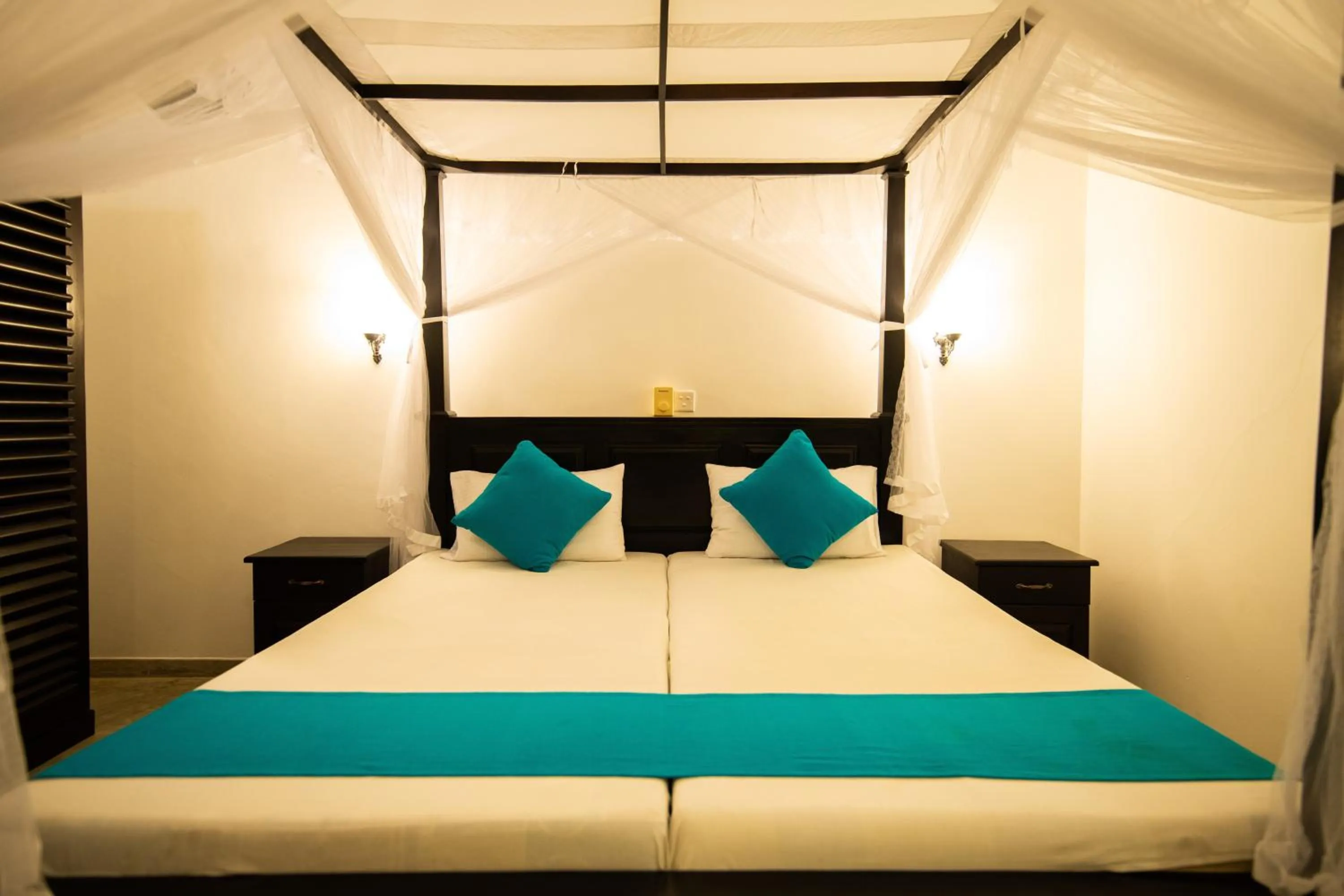 Bed in International Beach Hotel & Restaurant