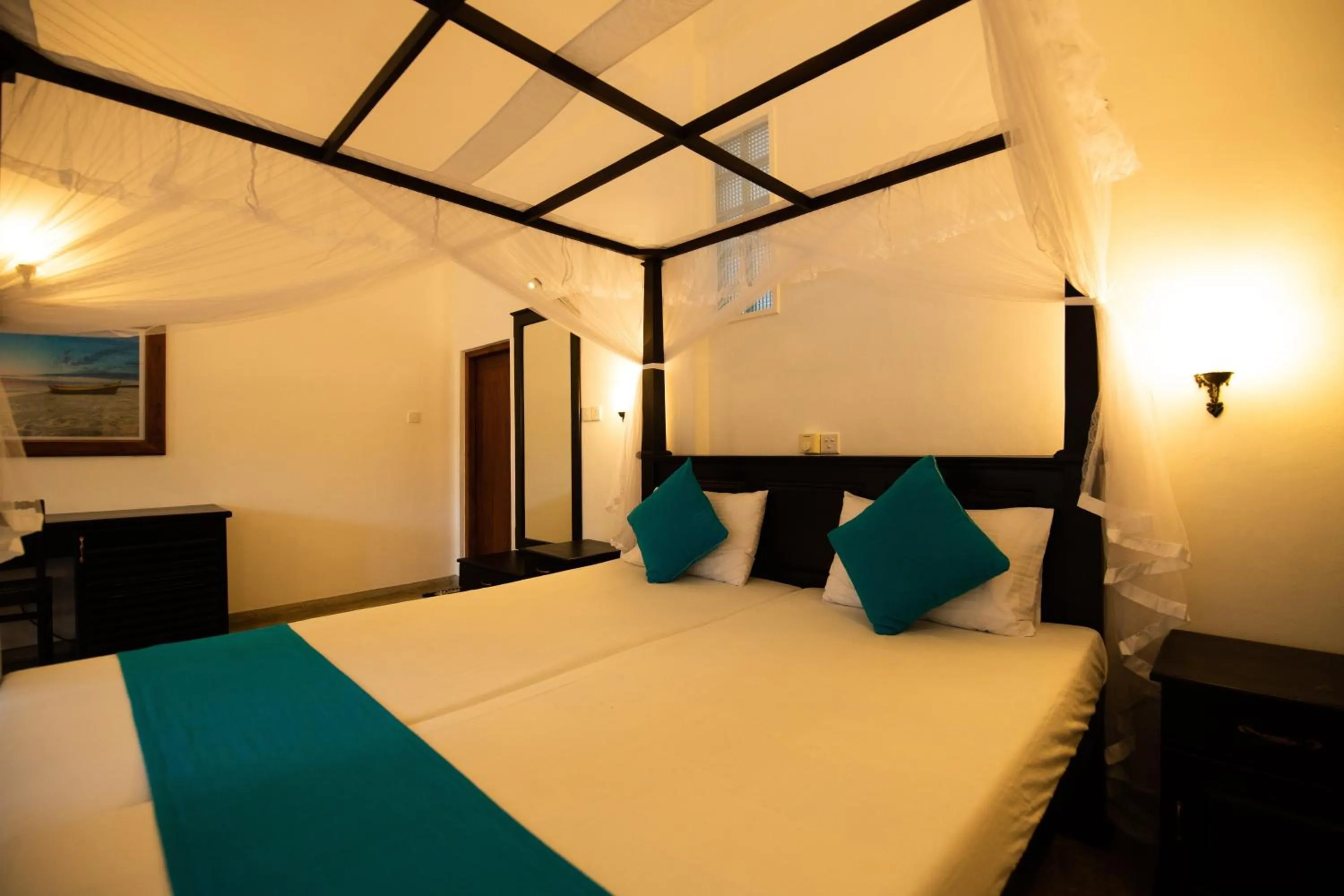 Bed in International Beach Hotel & Restaurant