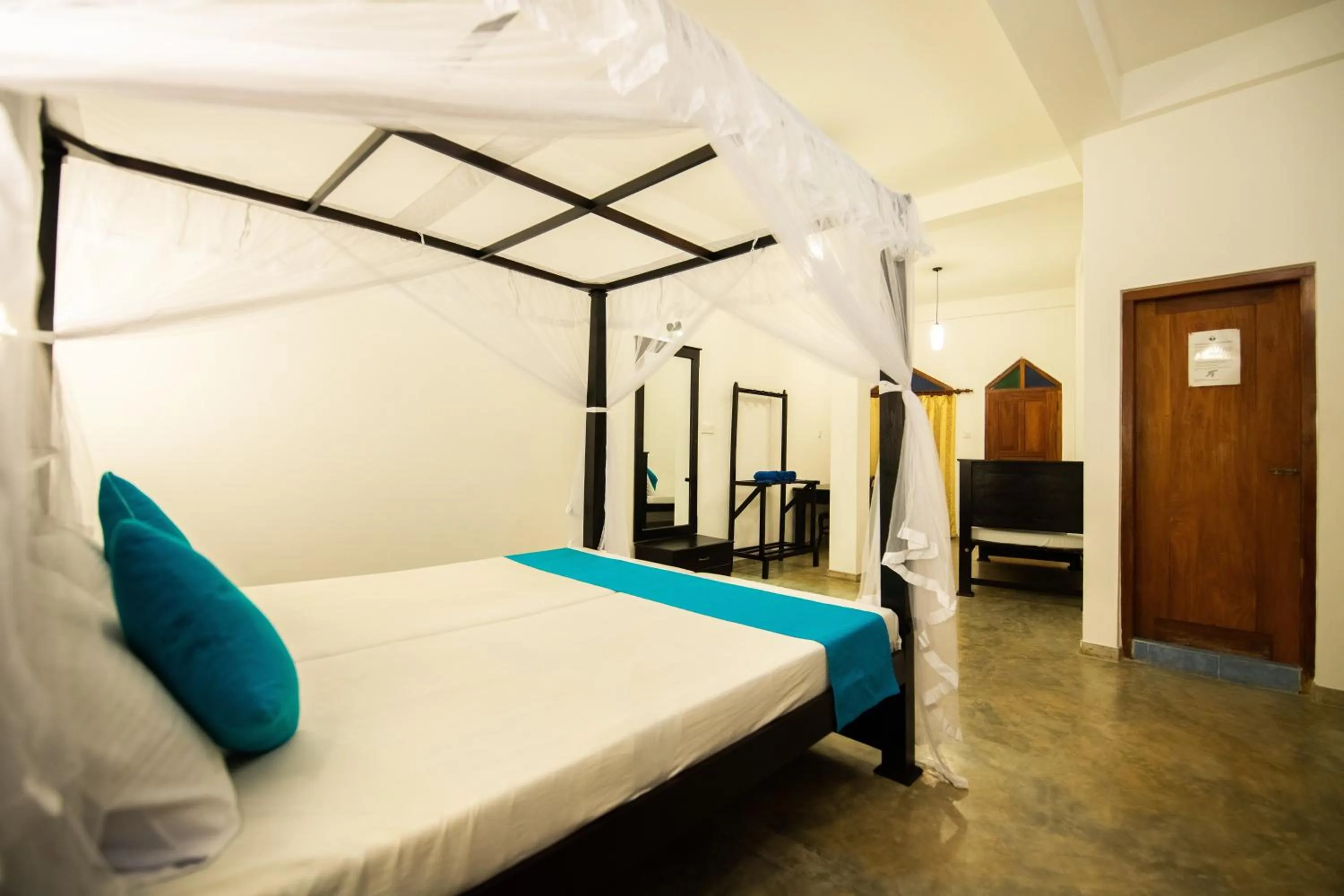 Bed in International Beach Hotel & Restaurant