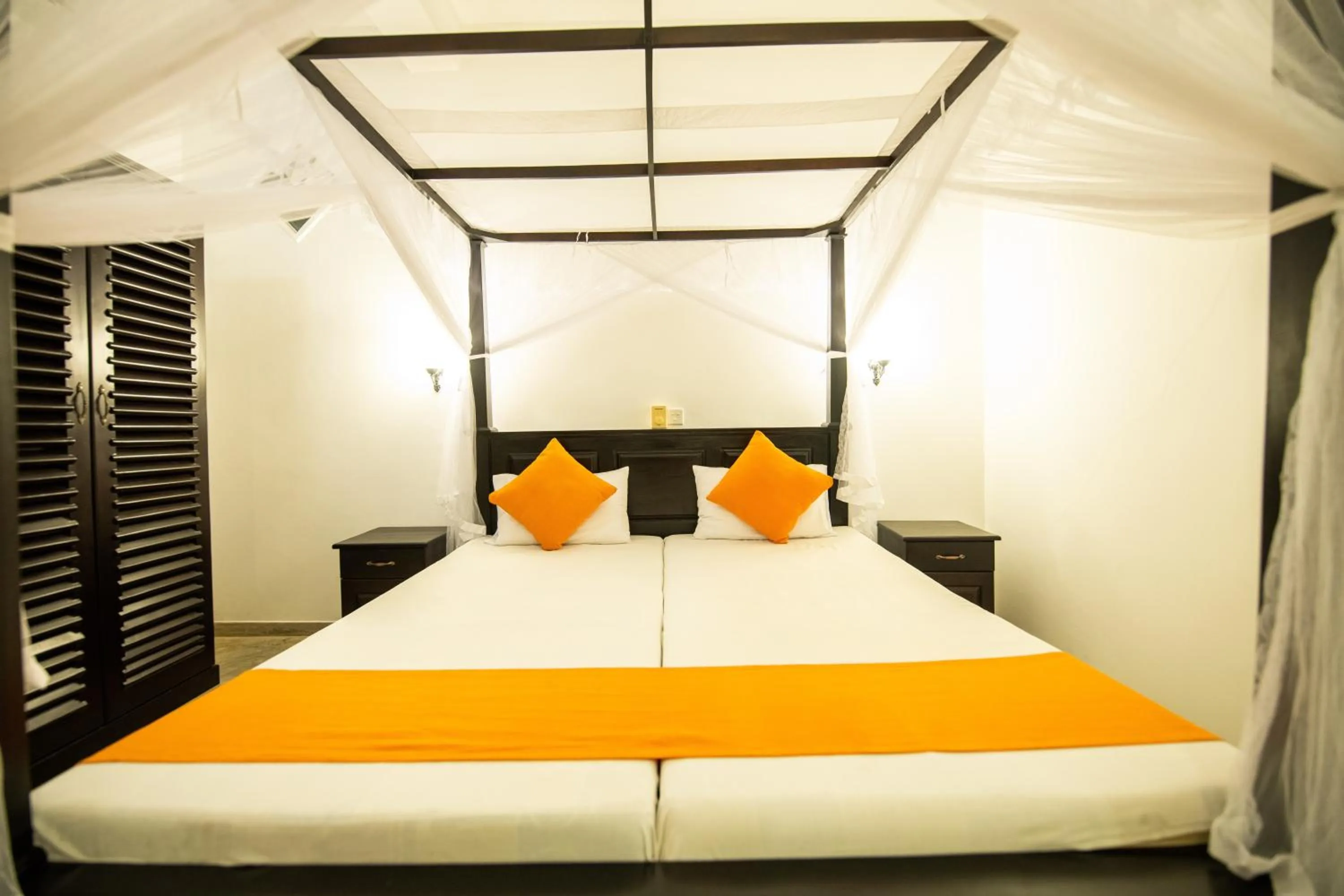 Bed in International Beach Hotel & Restaurant