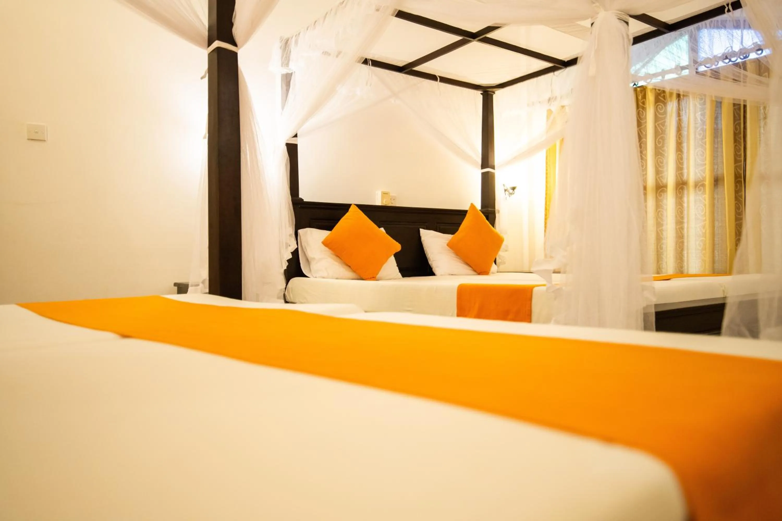 Bed in International Beach Hotel & Restaurant