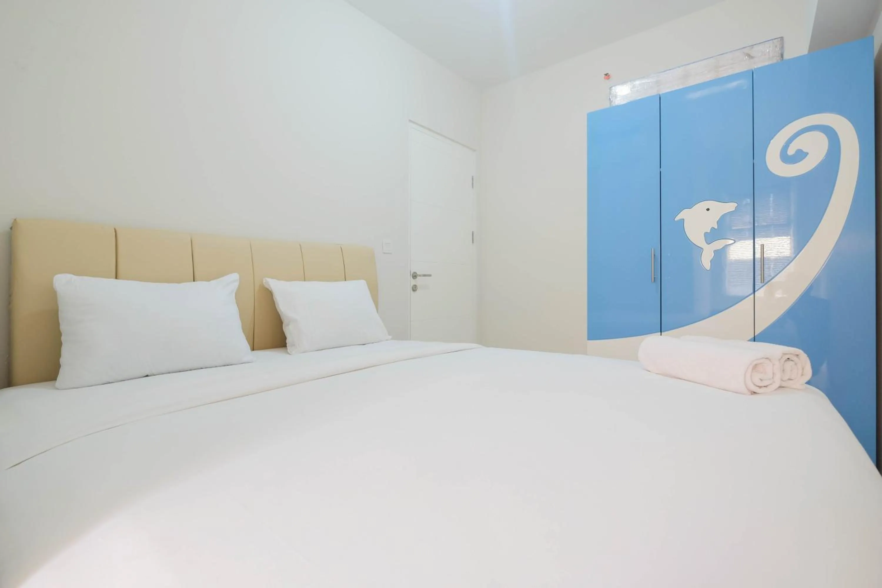 Bed in Minimalist 2BR Apartment The Springlake Summarecon By Travelio