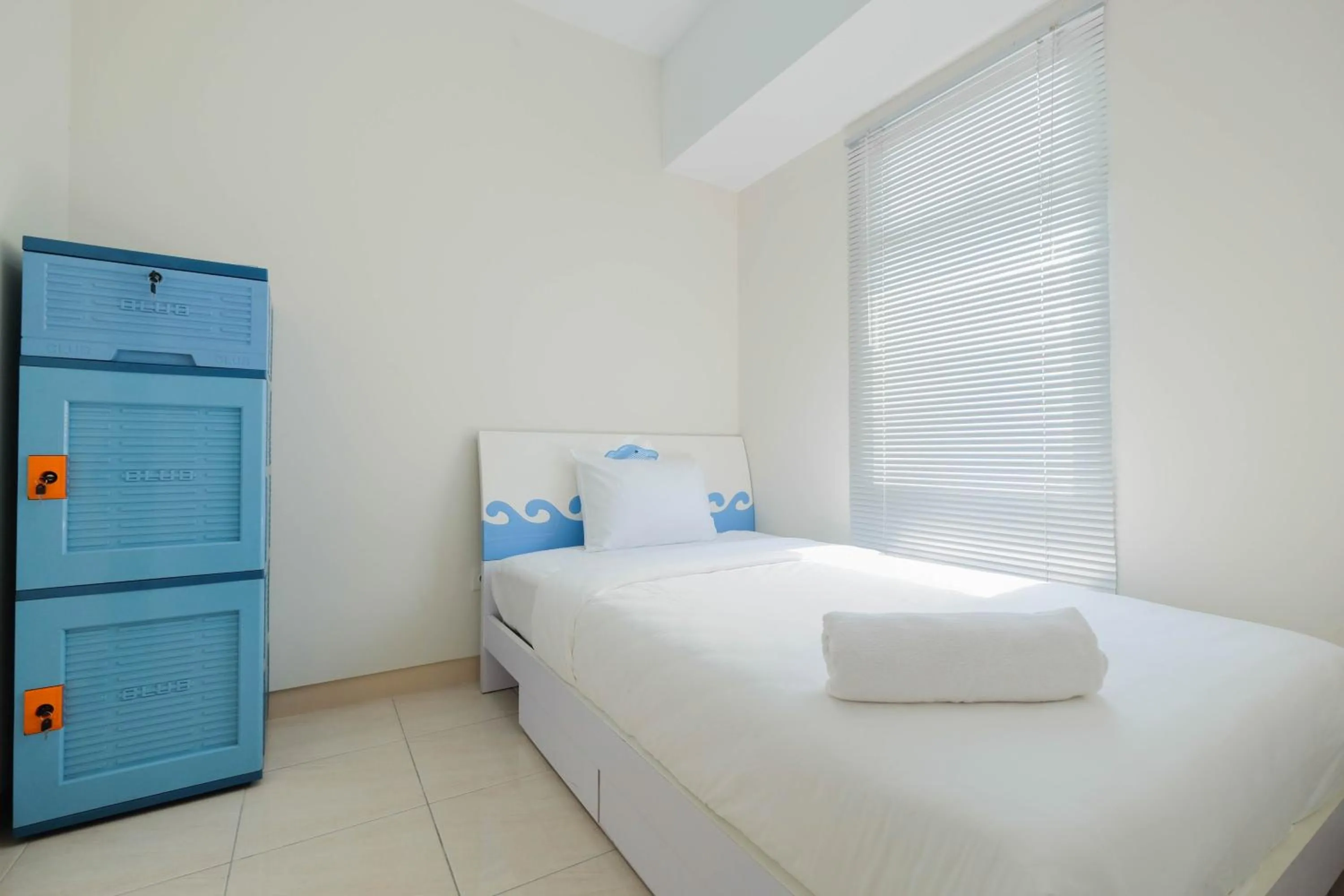 Bed in Minimalist 2BR Apartment The Springlake Summarecon By Travelio