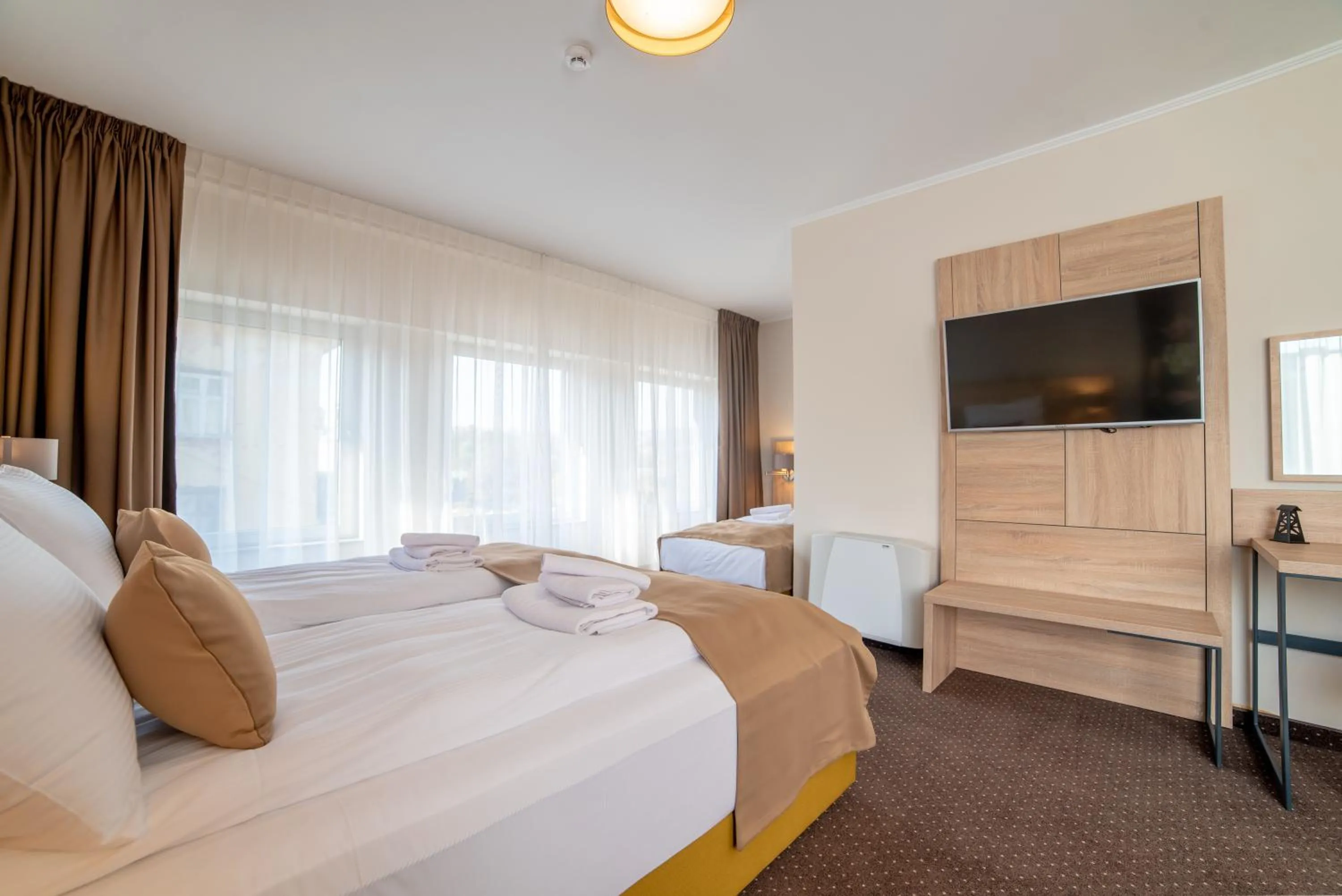 Bed in Hotel Soni Lux