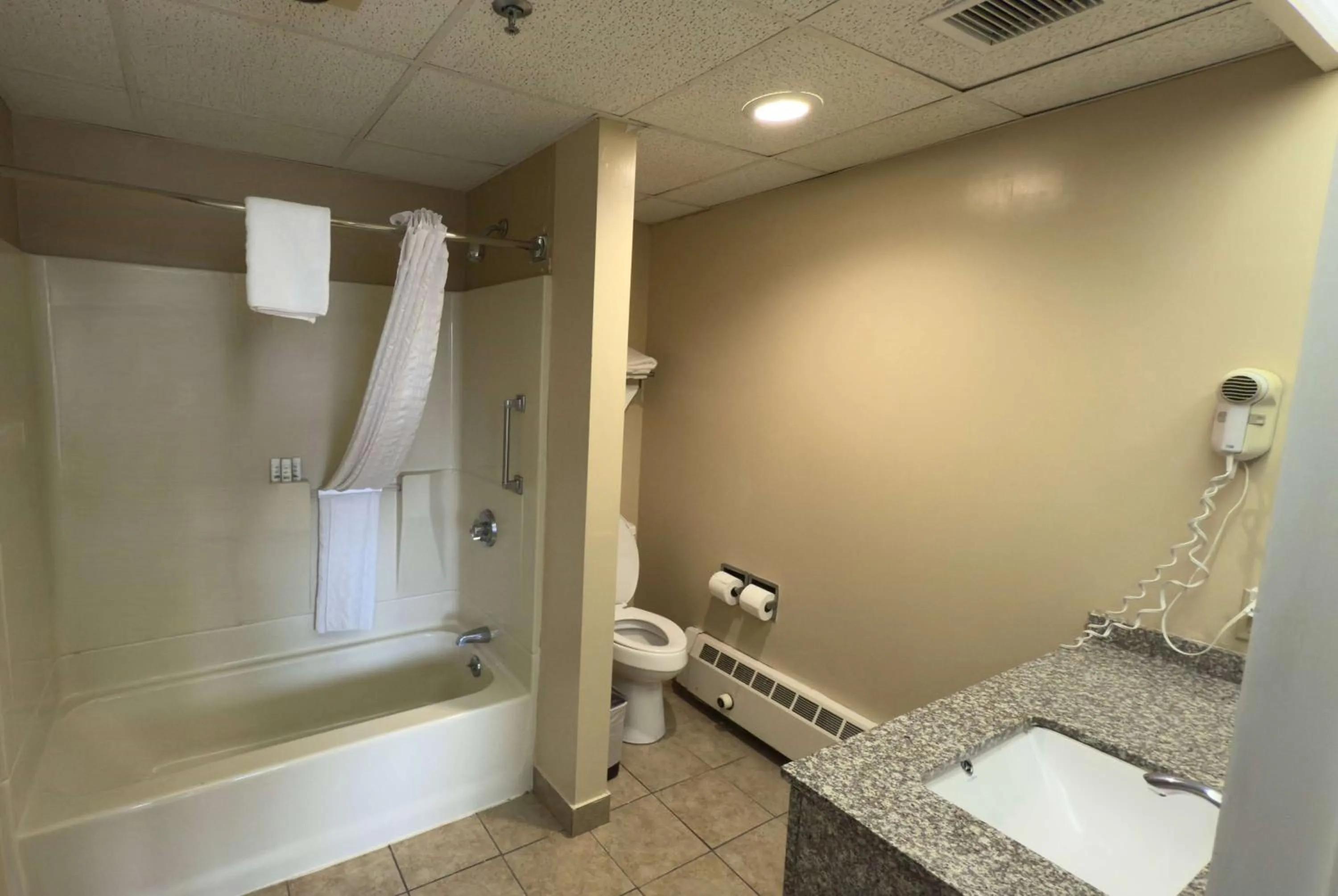 Bathroom in Ramada by Wyndham Seekonk Providence Area