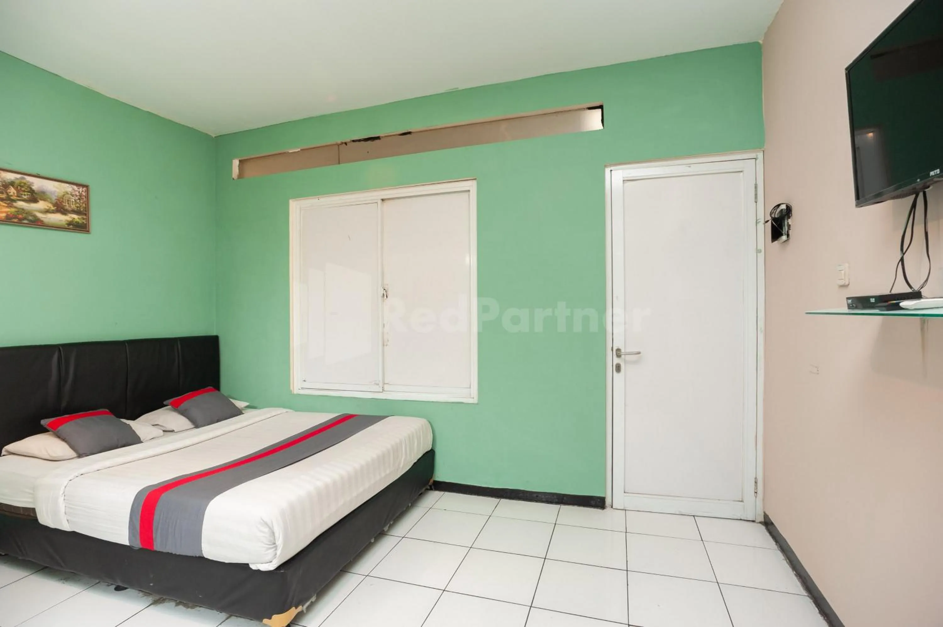 Bed in J&B Rooms Pramuka Jakarta Mitra RedDoorz