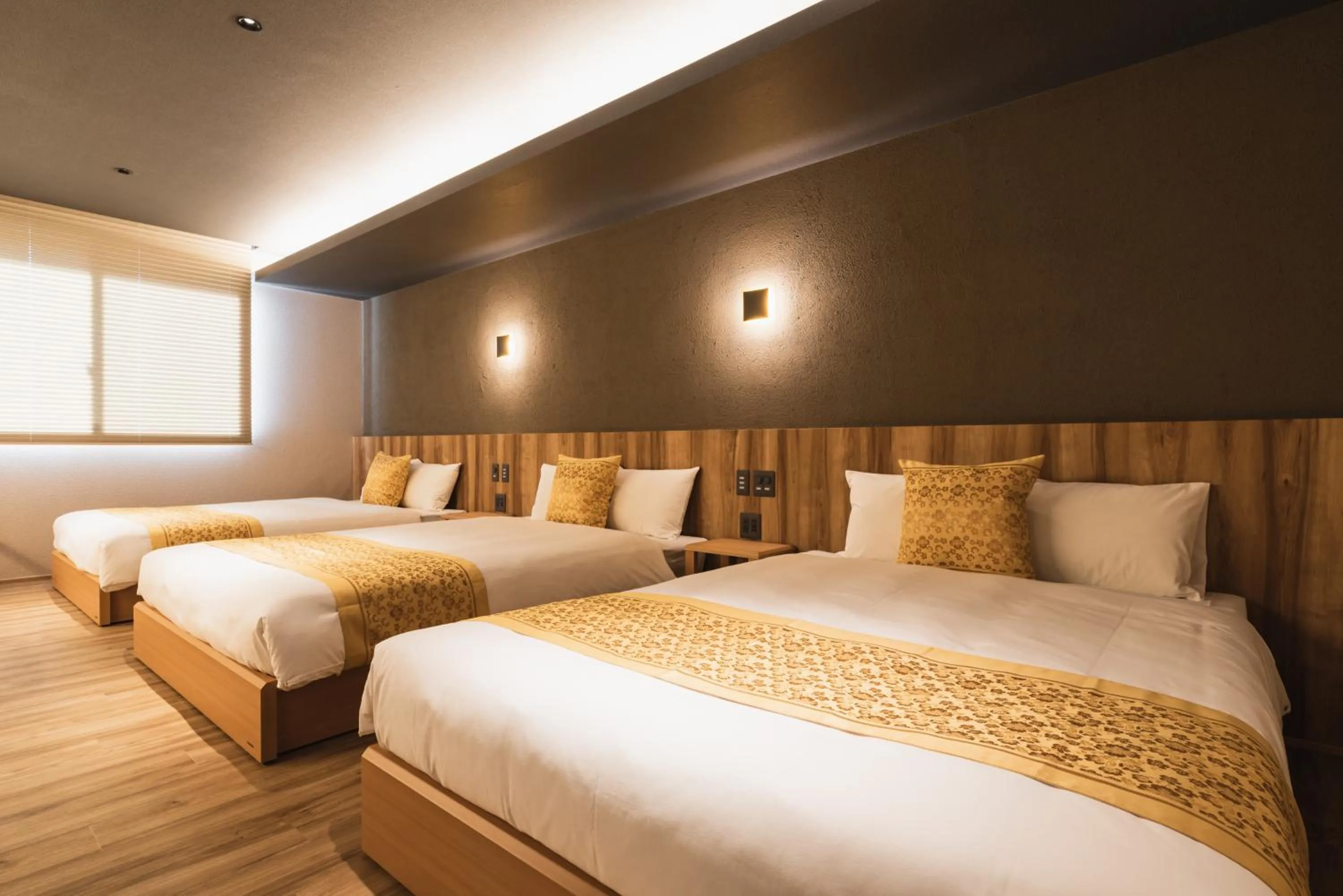 Bed in GRAND BASE Beppu Ekihigashi