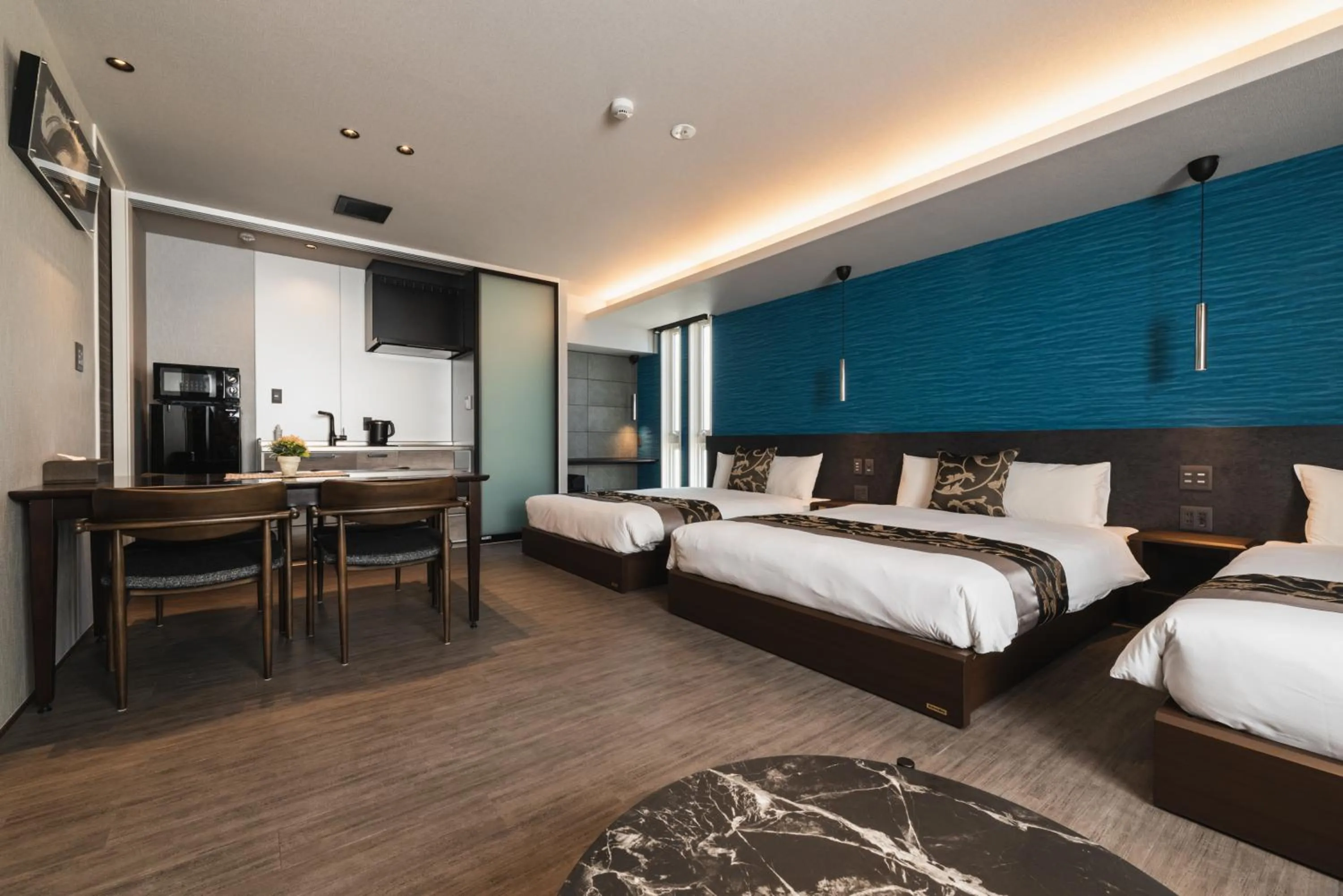 Photo of the whole room, Bed in GRAND BASE Beppu Ekihigashi