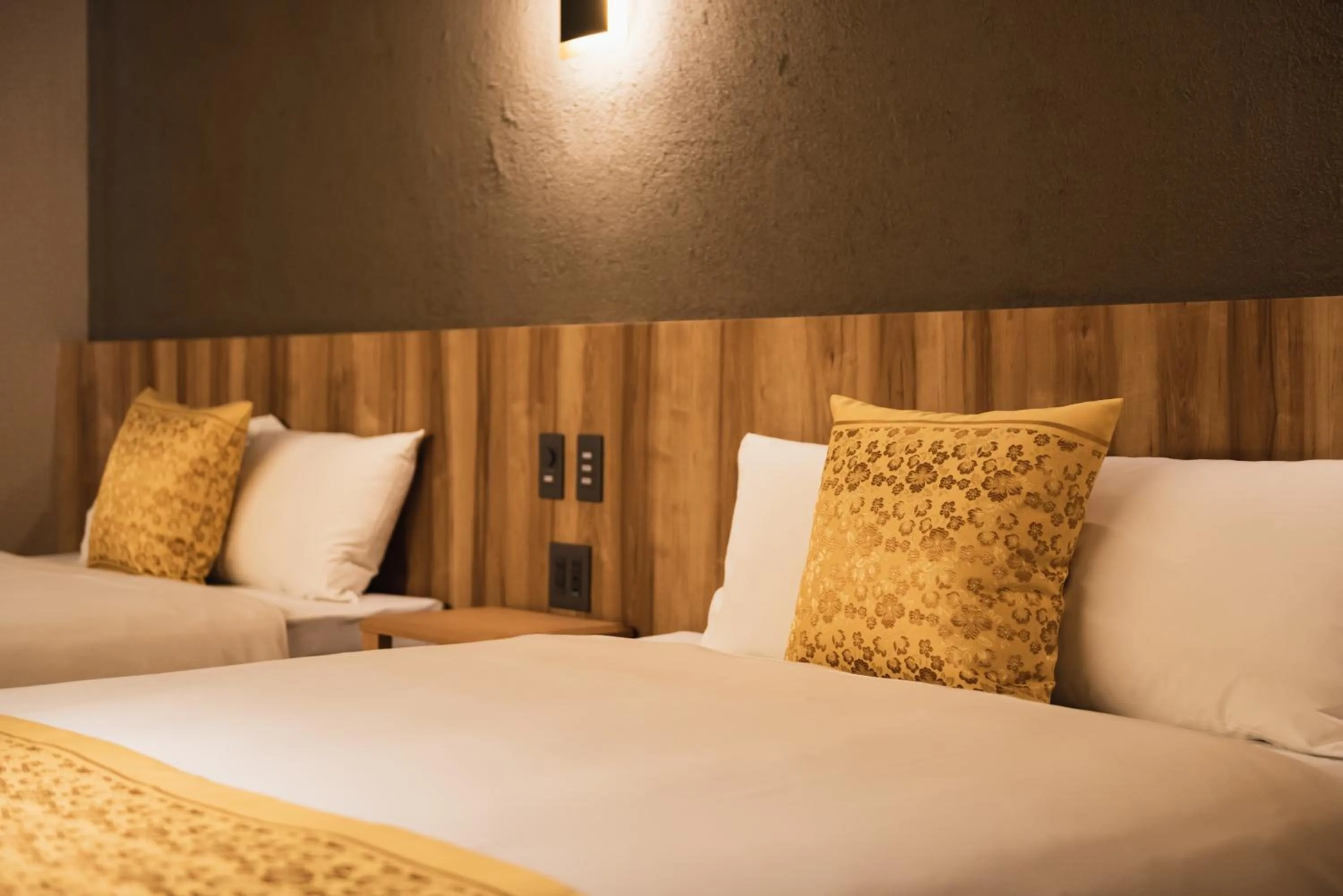 Bed in GRAND BASE Beppu Ekihigashi