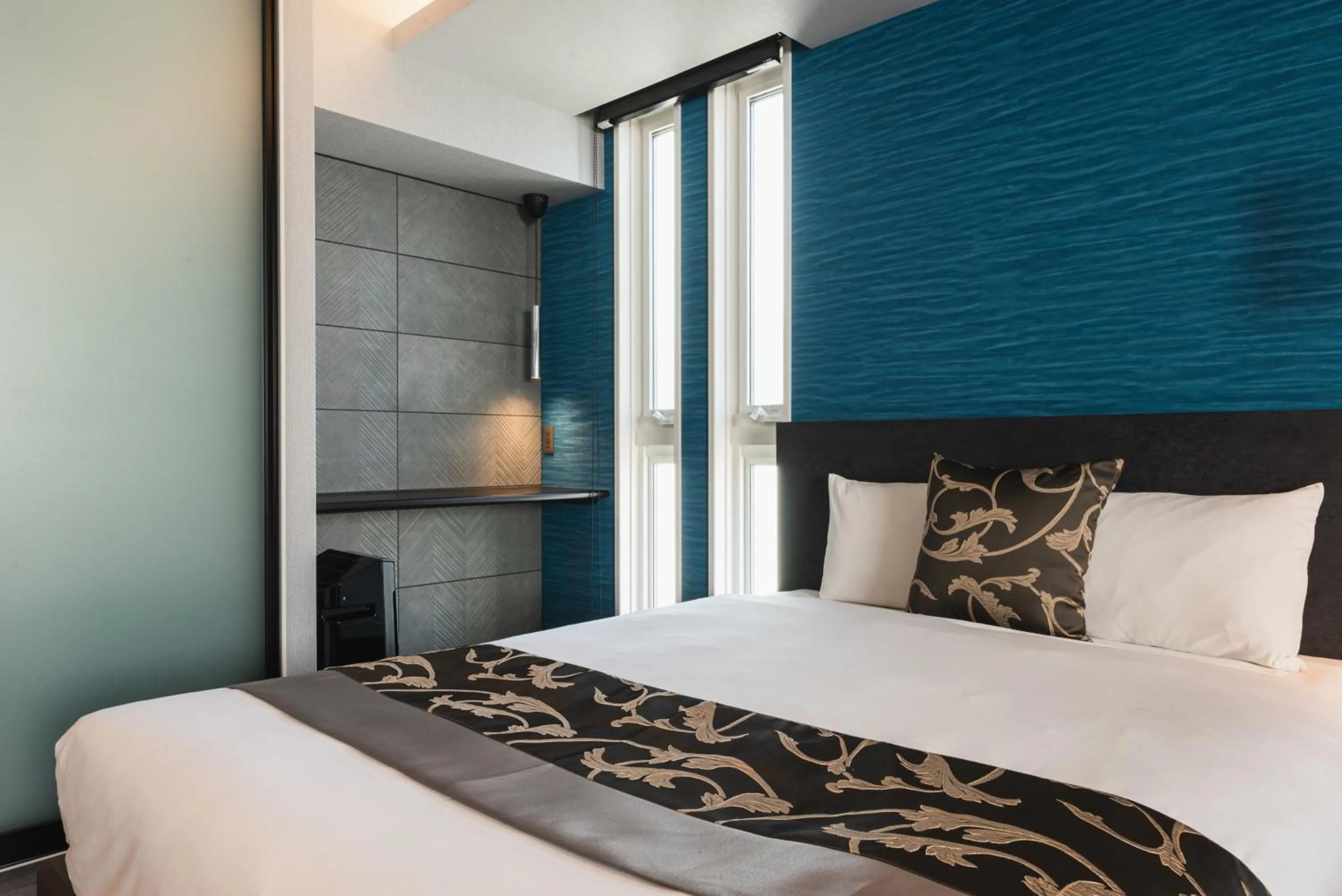 Bed in GRAND BASE Beppu Ekihigashi