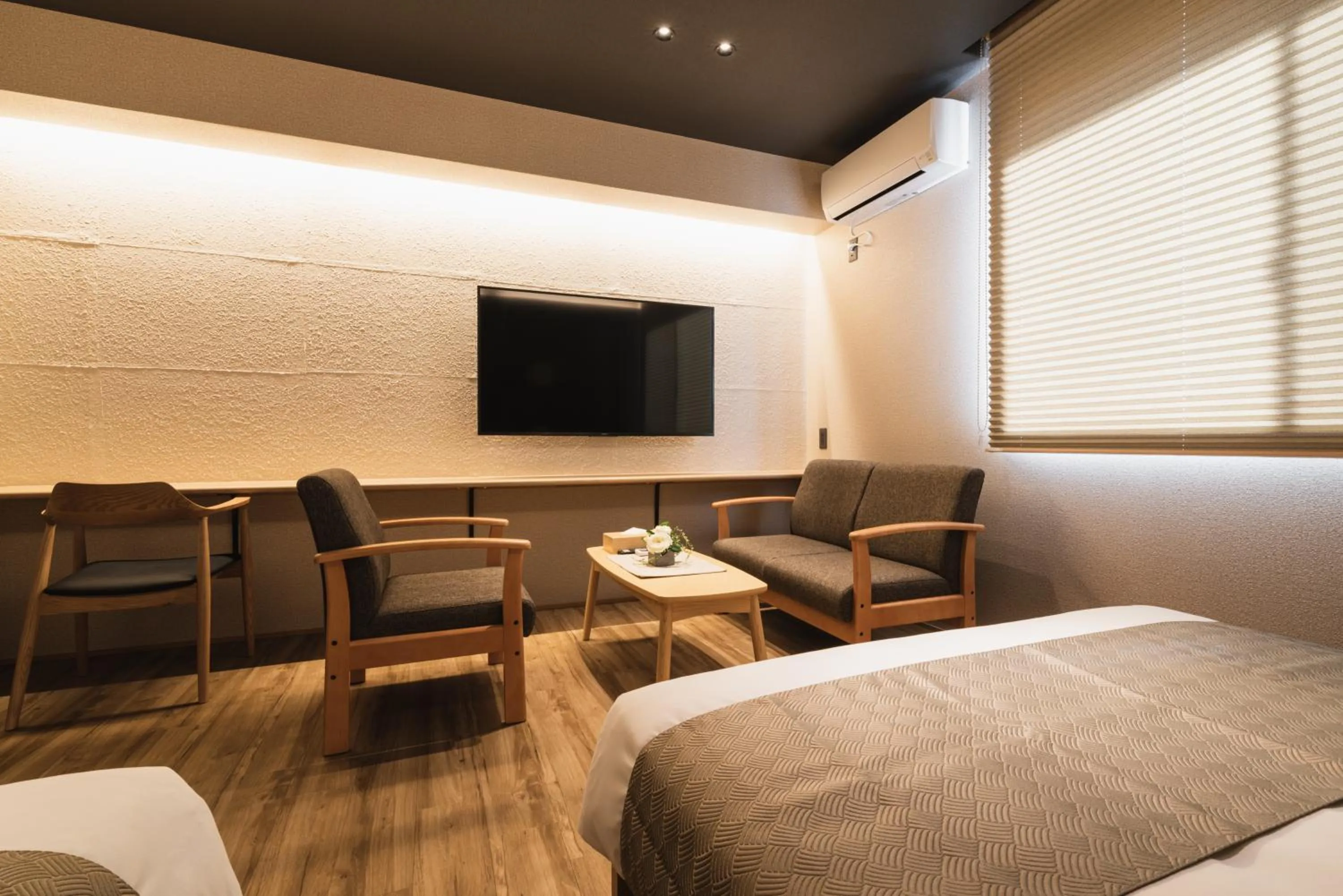 Photo of the whole room, Bed in GRAND BASE Beppu Ekihigashi