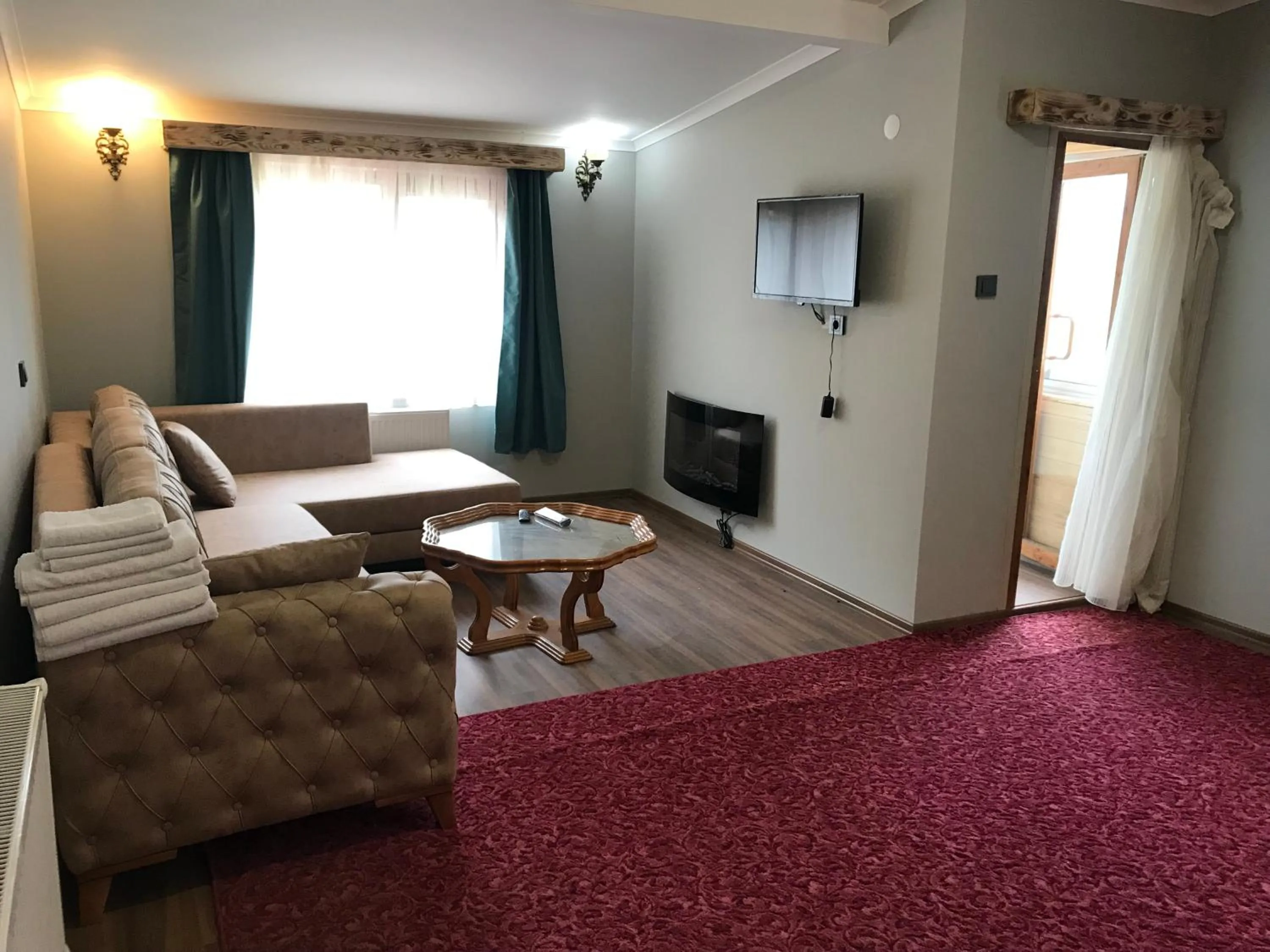 Seating area, Bed in Yedigoller Hotel & Restaurant