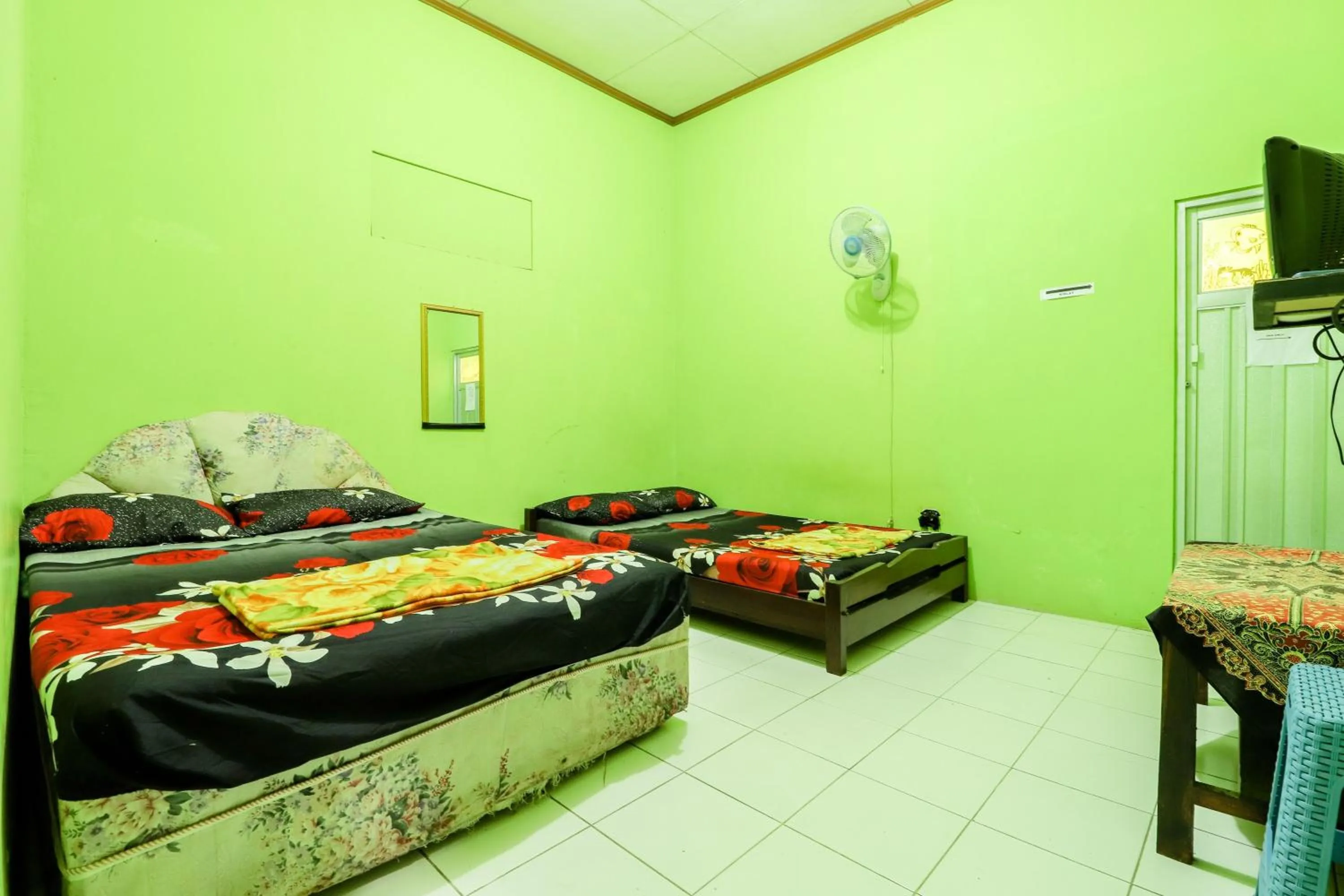 Photo of the whole room, Bed in Penginapan Roro Mendut Syariah