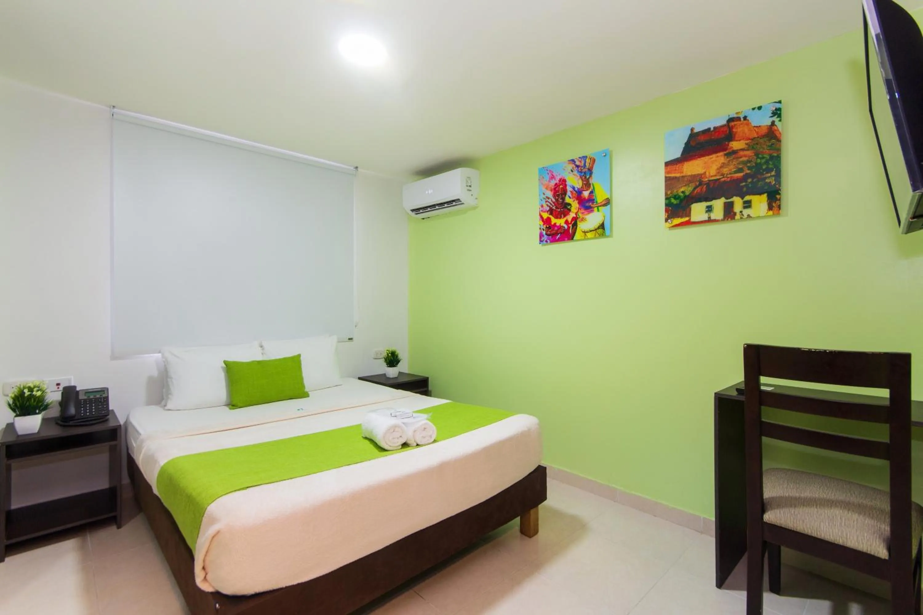 Bed in Hotel Avexi Suites By GEH Suites