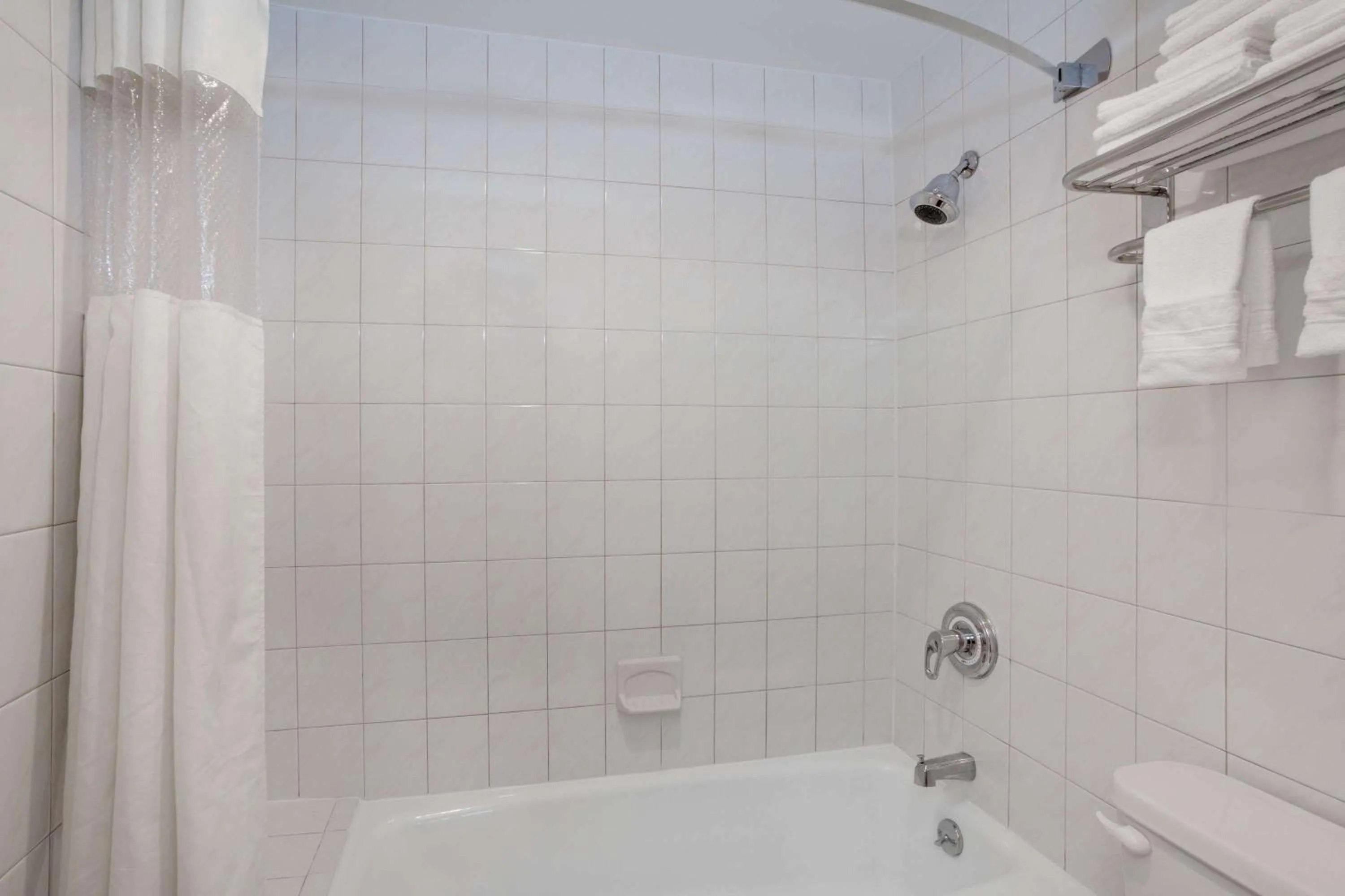 Bathroom in Days Inn by Wyndham Woodbury Long Island