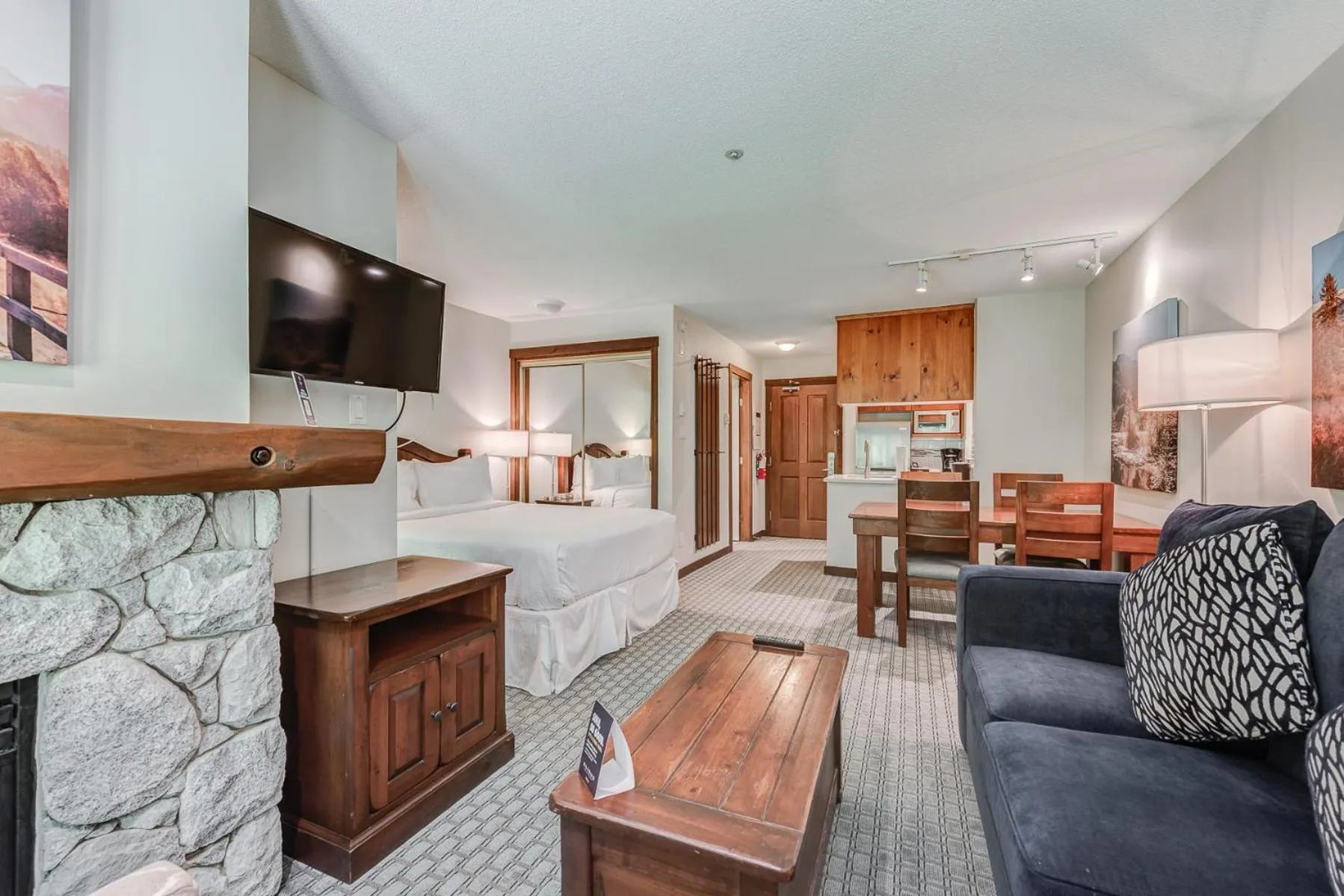 TV and multimedia in Blackcomb Springs Suites by CLIQUE