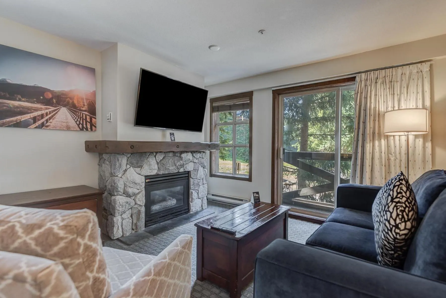 Communal lounge/ TV room in Blackcomb Springs Suites by CLIQUE