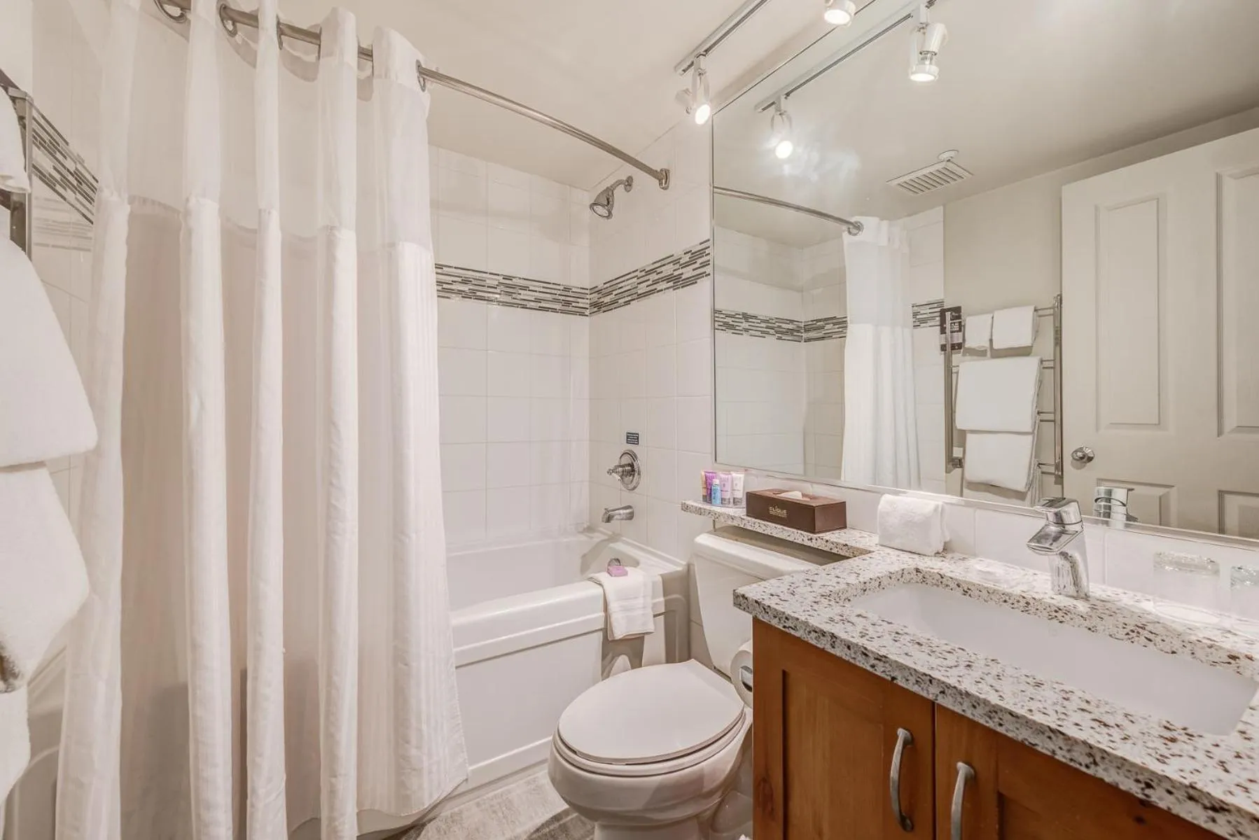 Shower in Blackcomb Springs Suites by CLIQUE