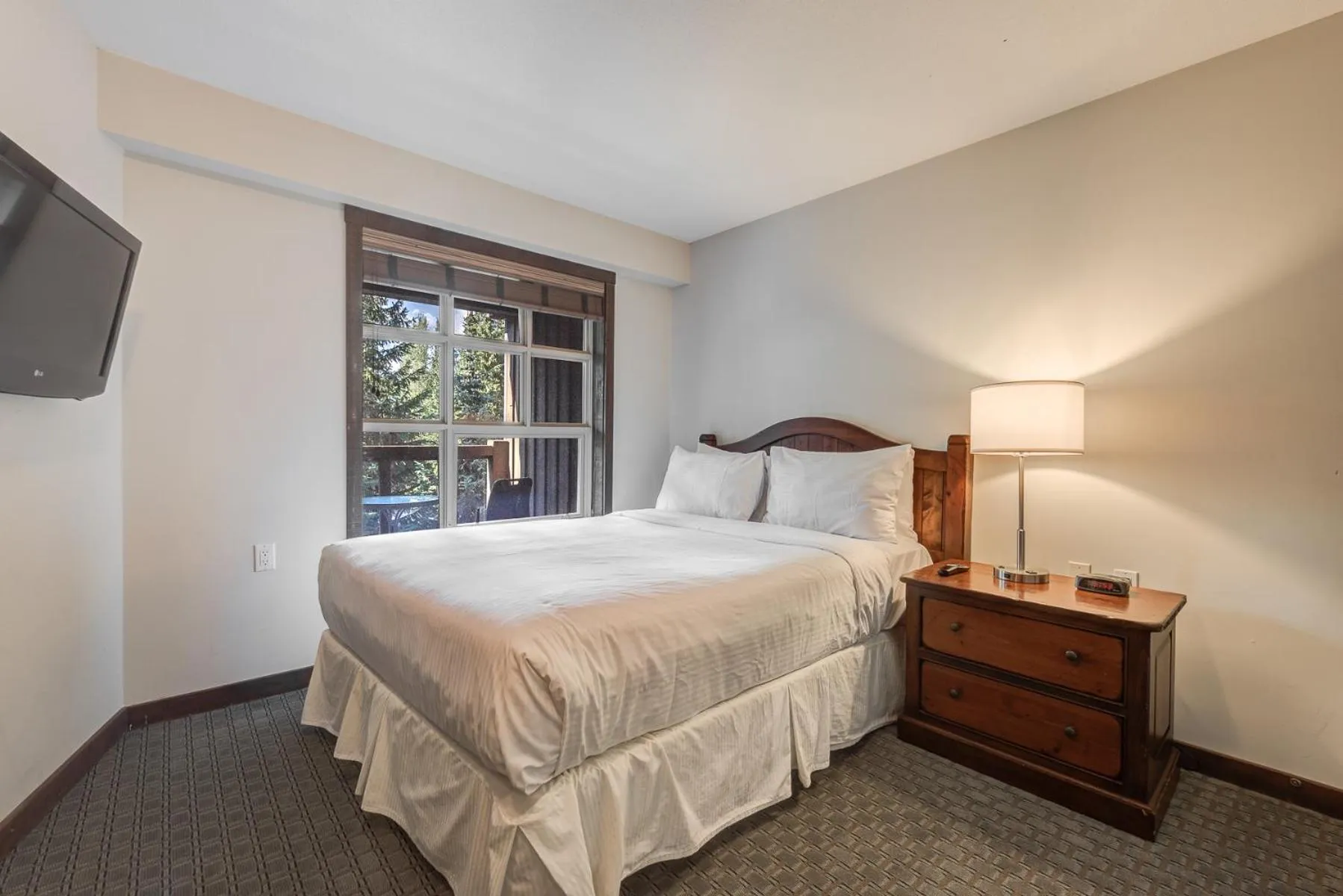 Bed in Blackcomb Springs Suites by CLIQUE