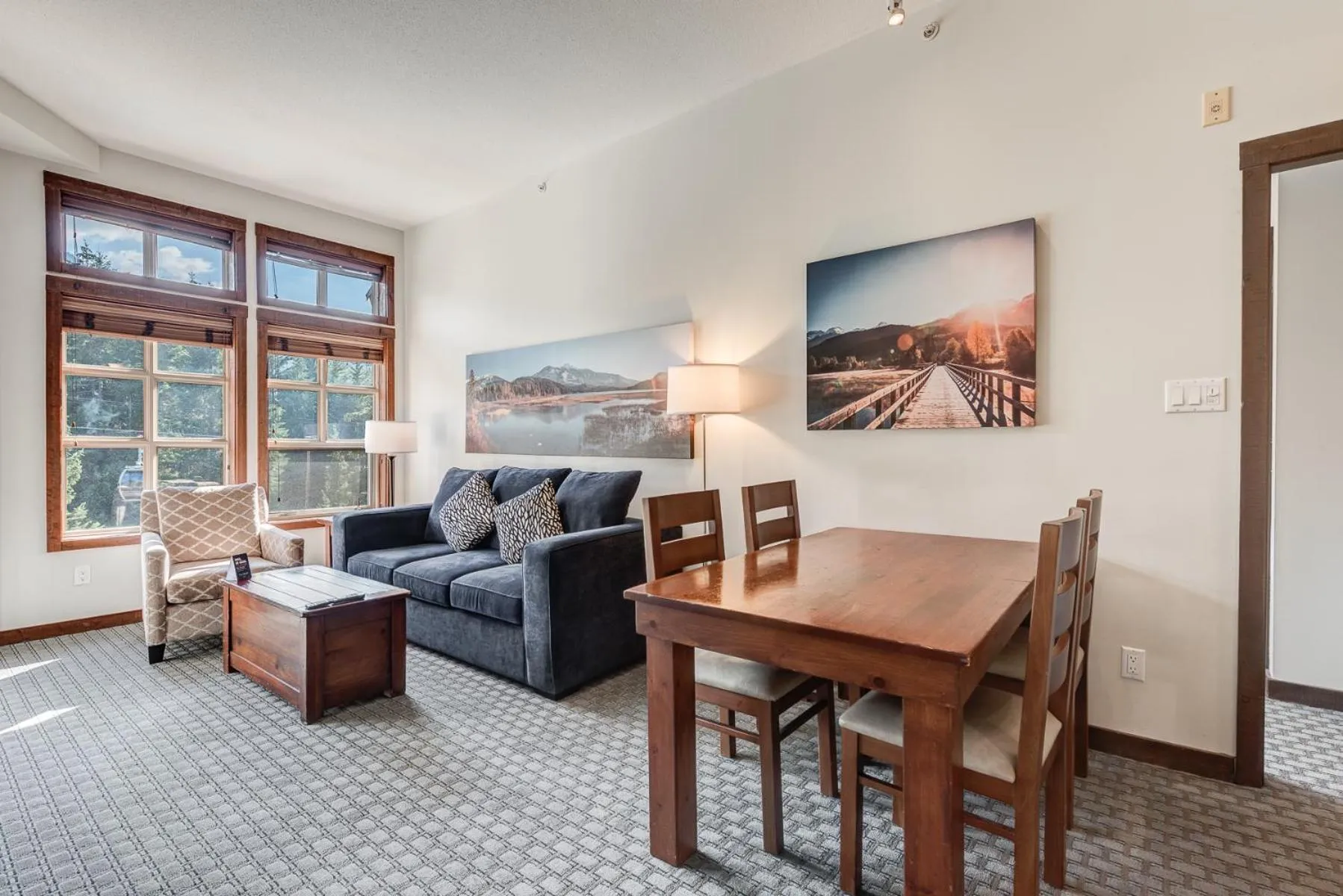 Living room in Blackcomb Springs Suites by CLIQUE