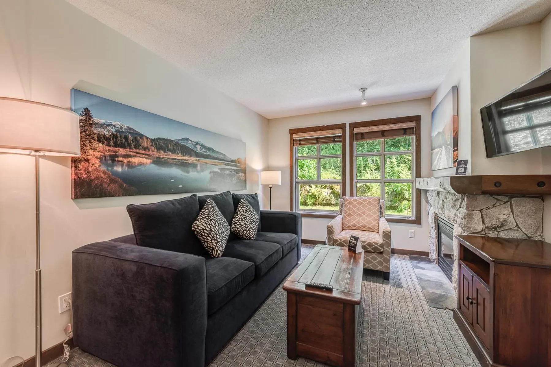 TV and multimedia in Blackcomb Springs Suites by CLIQUE