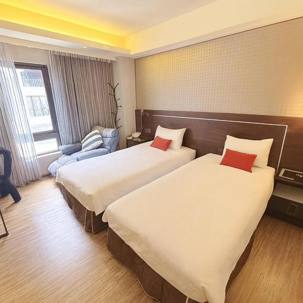 Bed in HopeCity MinSheng Hotel