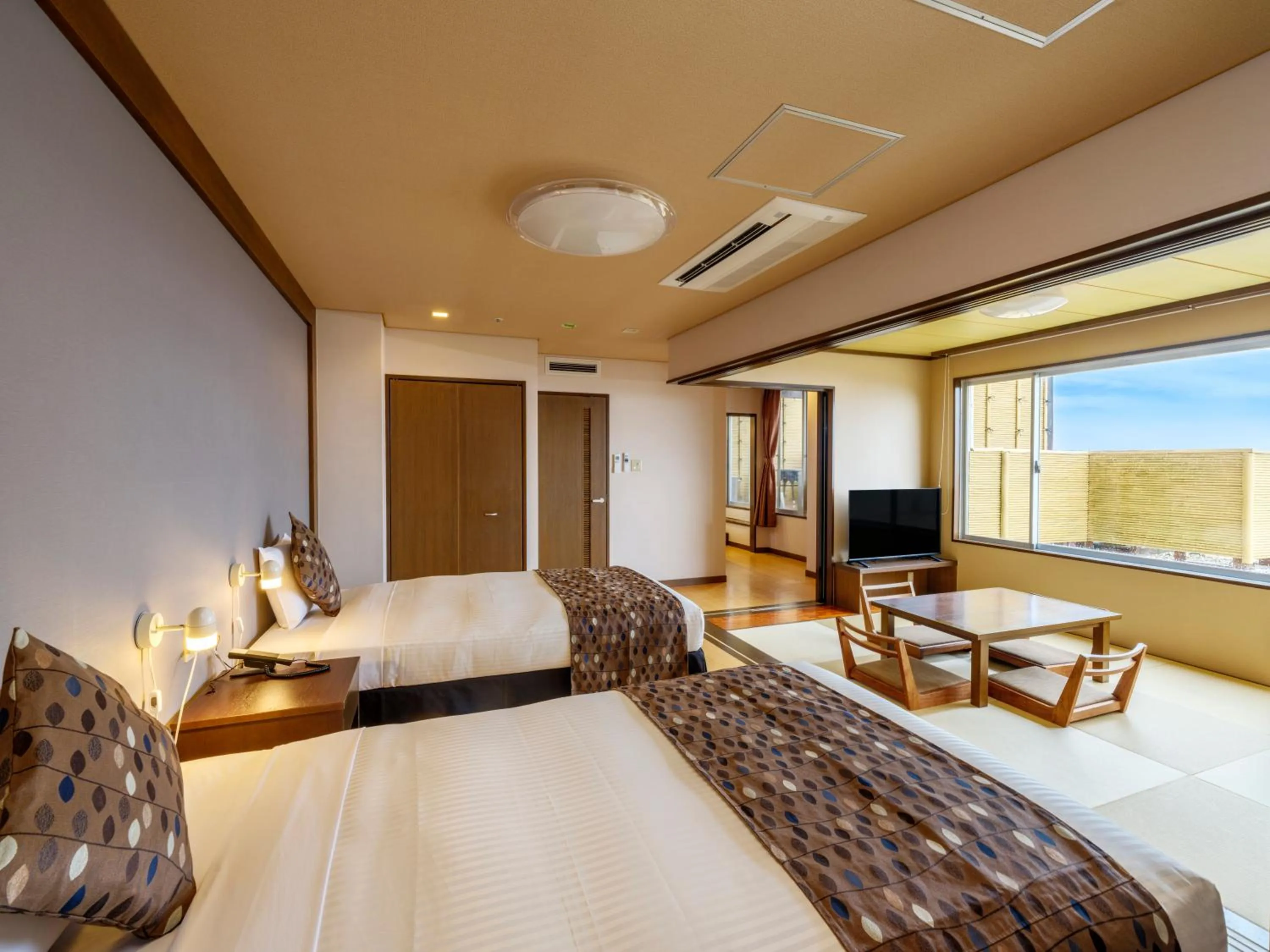 Bed in KAMENOI HOTEL Oarai