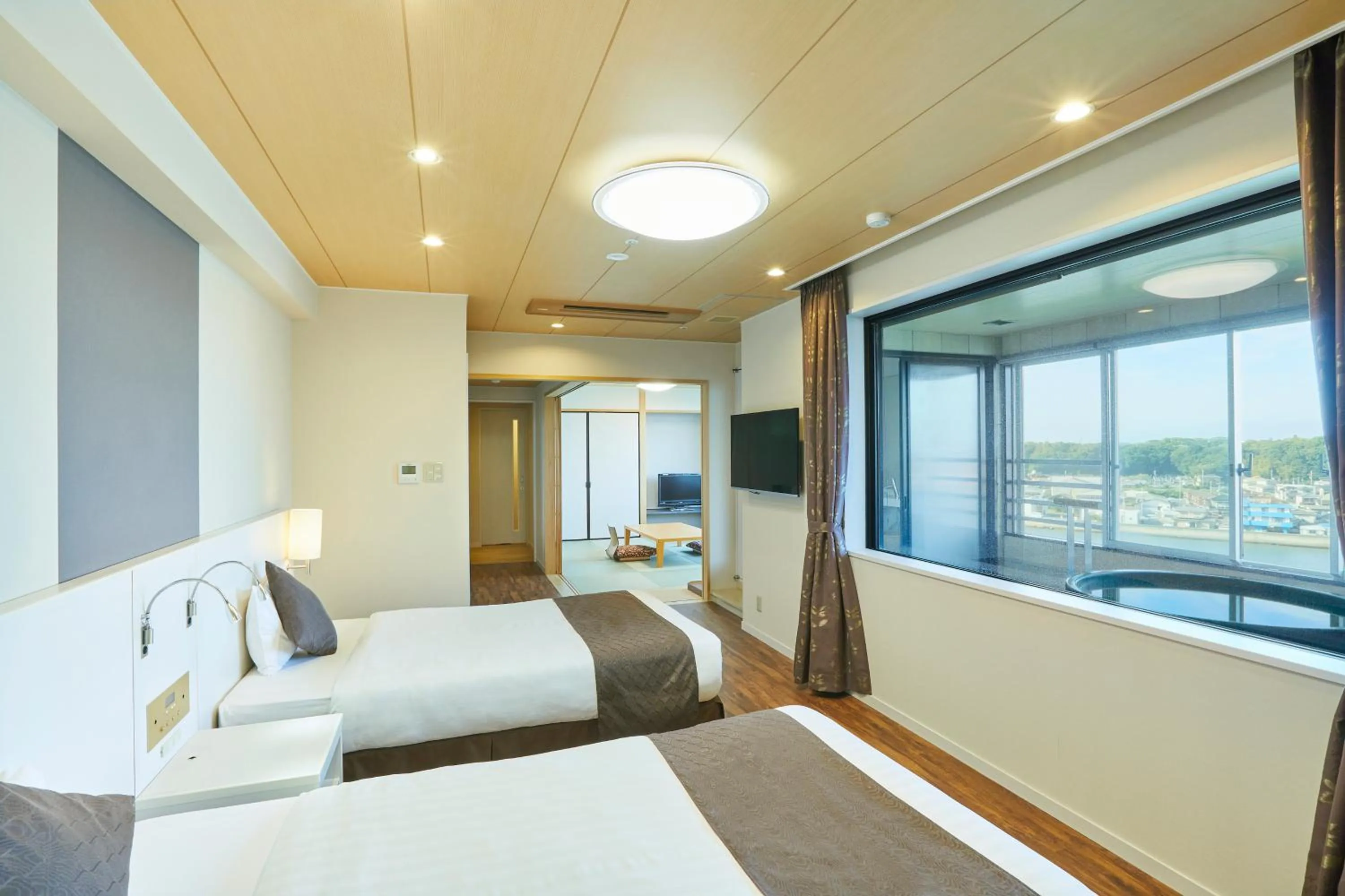 Photo of the whole room, Bed in KAMENOI HOTEL Oarai