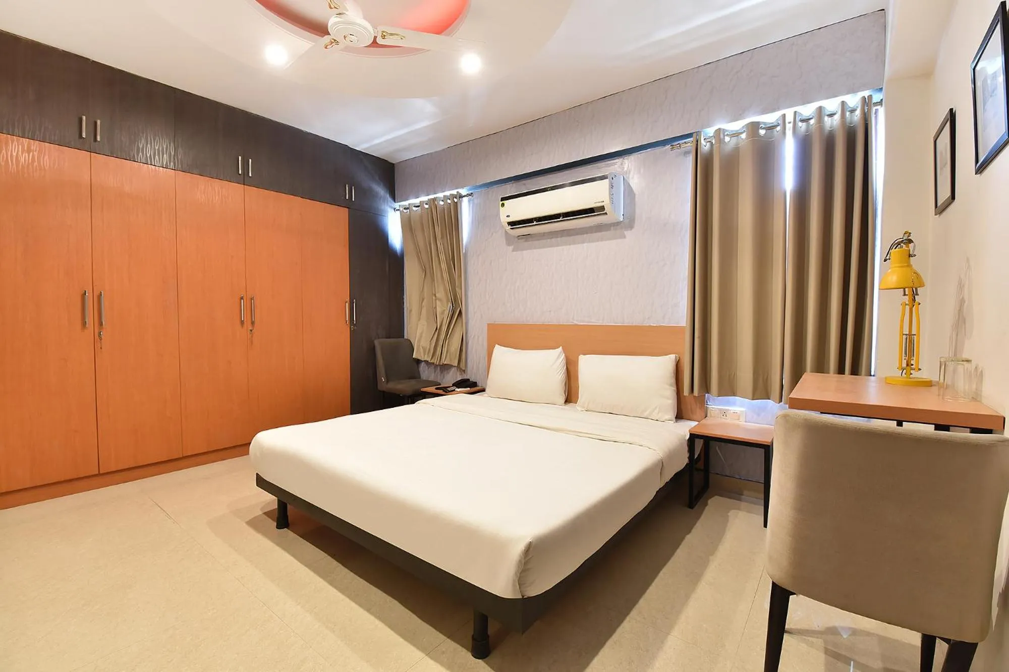 Bed in FabHotel Rushank Palace