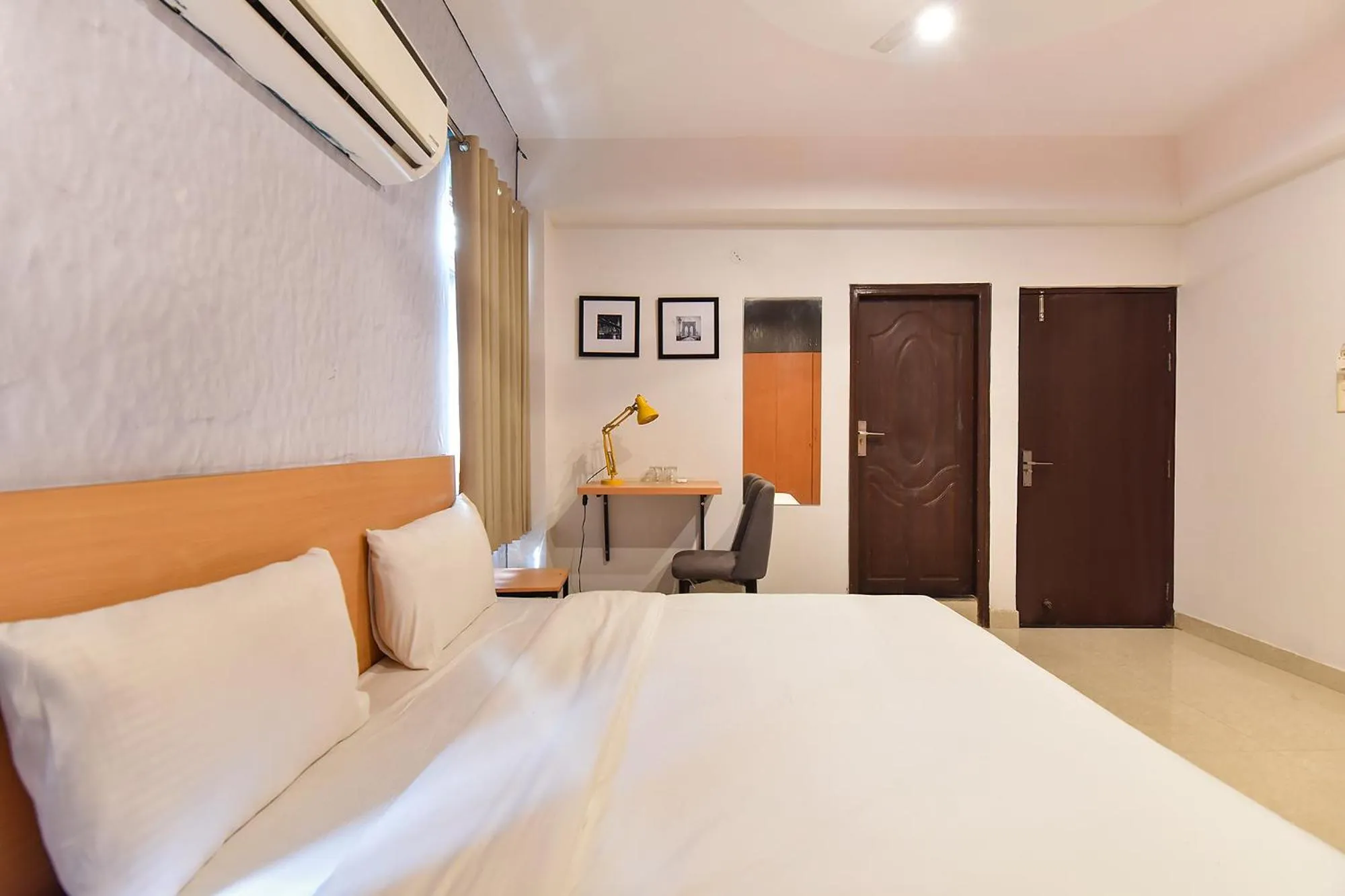 Bed in FabHotel Rushank Palace