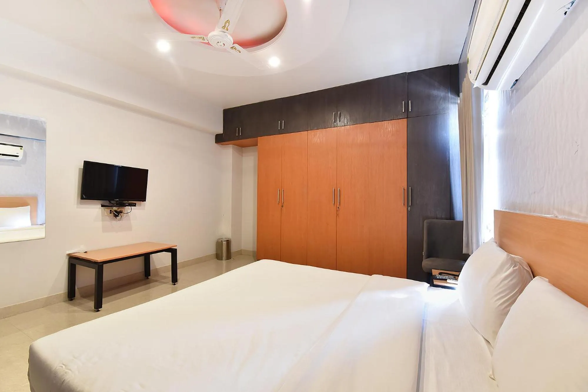 Bed in FabHotel Rushank Palace