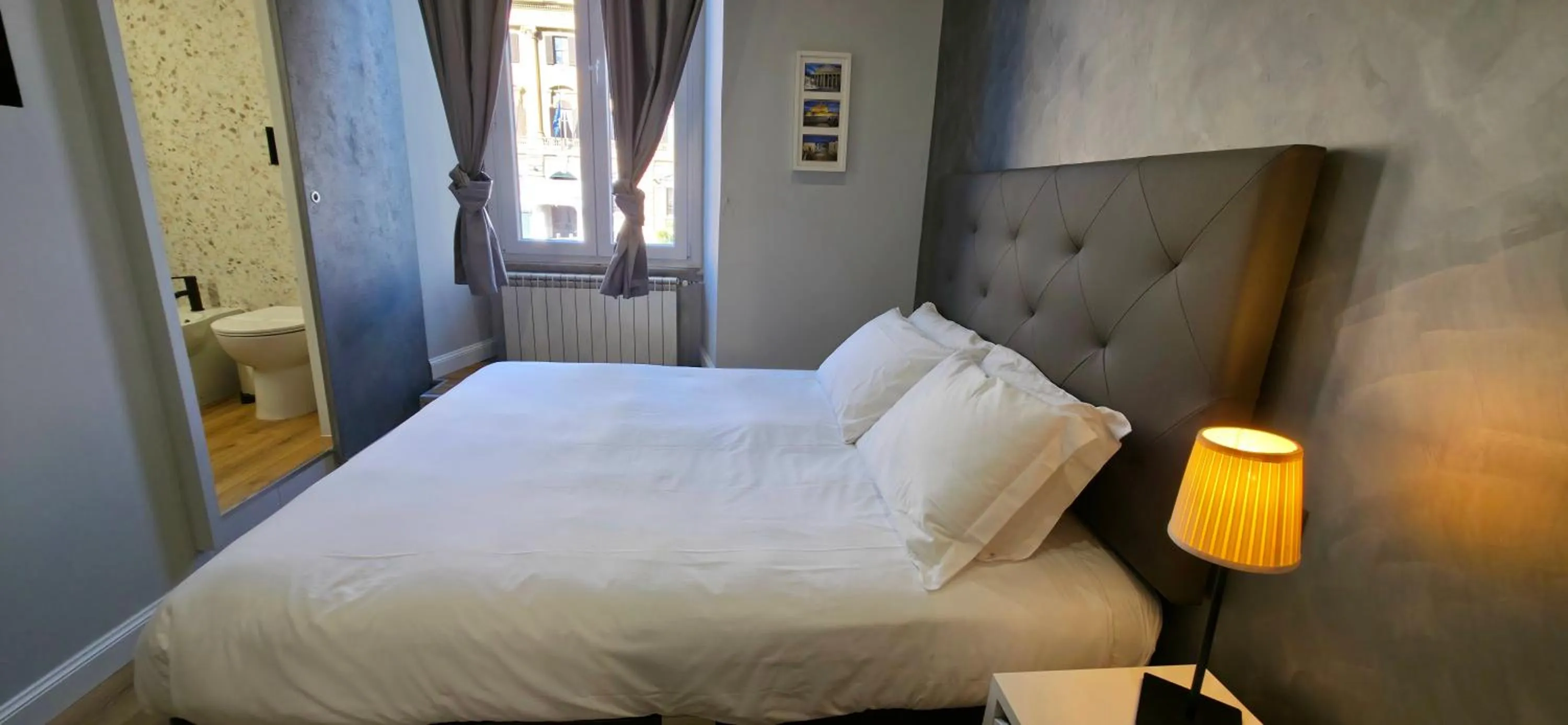 Bed in AmoRoma Suite