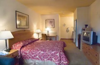 Bed in Garden Inn Hotel