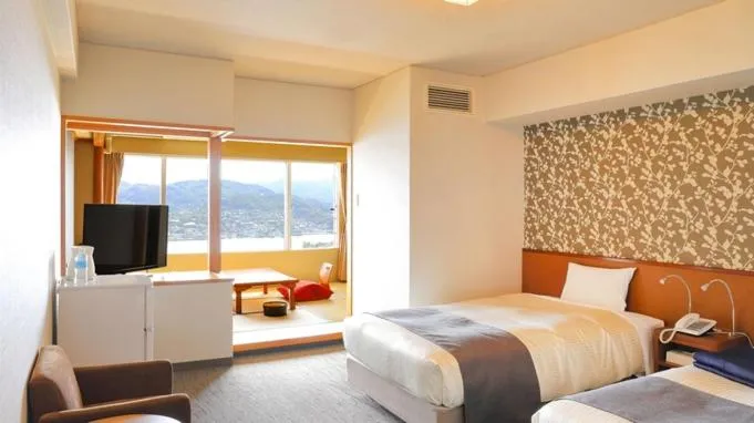 Bed in Ooedo Onsen Monogatari Nagasaki Hotel Seifu