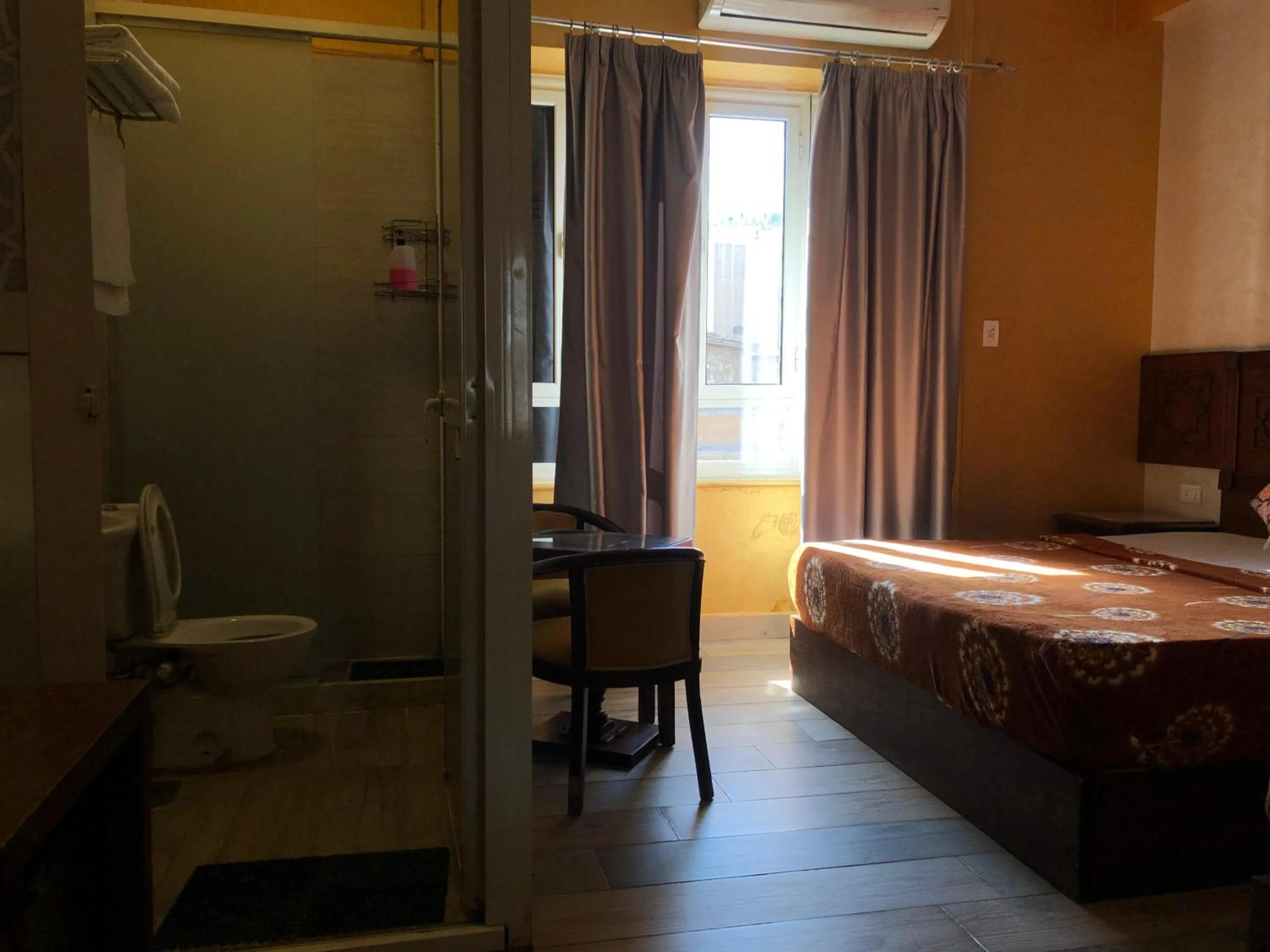 Bathroom, Bed in The location Hotel