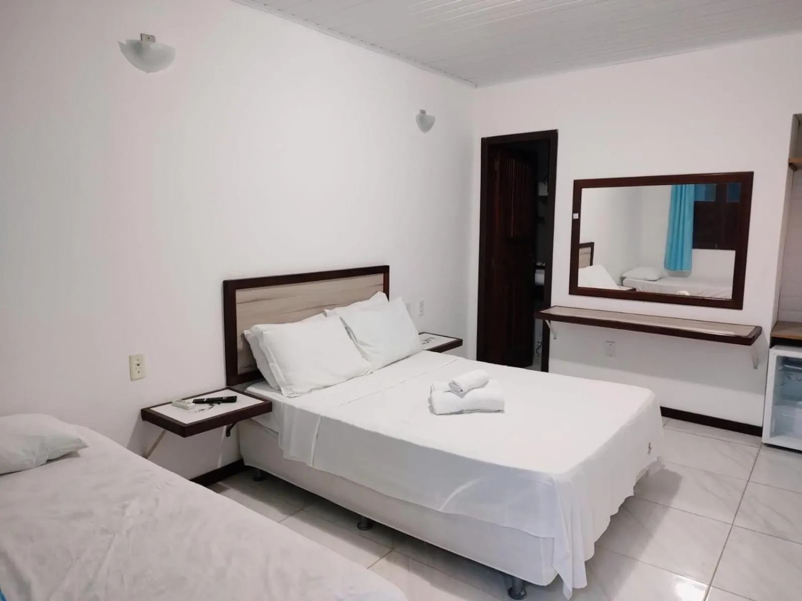 Bed in Pousada Camburi Star