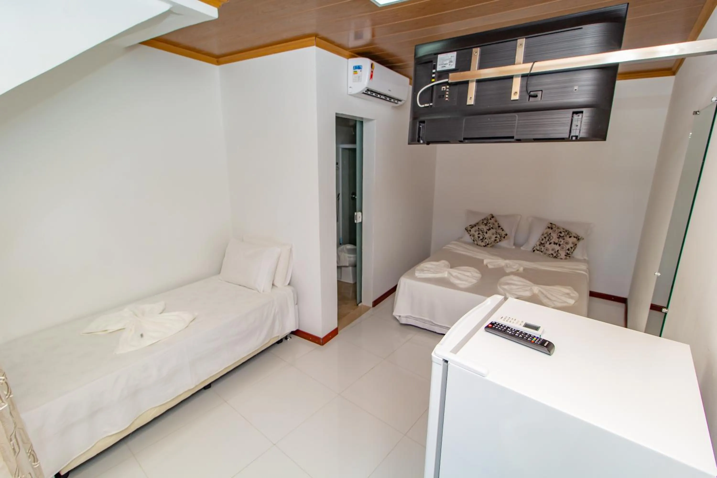 Bed in Pousada Camburi Star