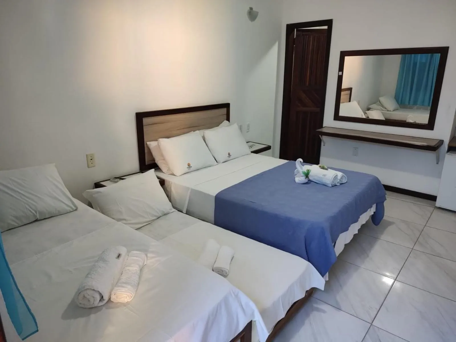 Bed in Pousada Camburi Star