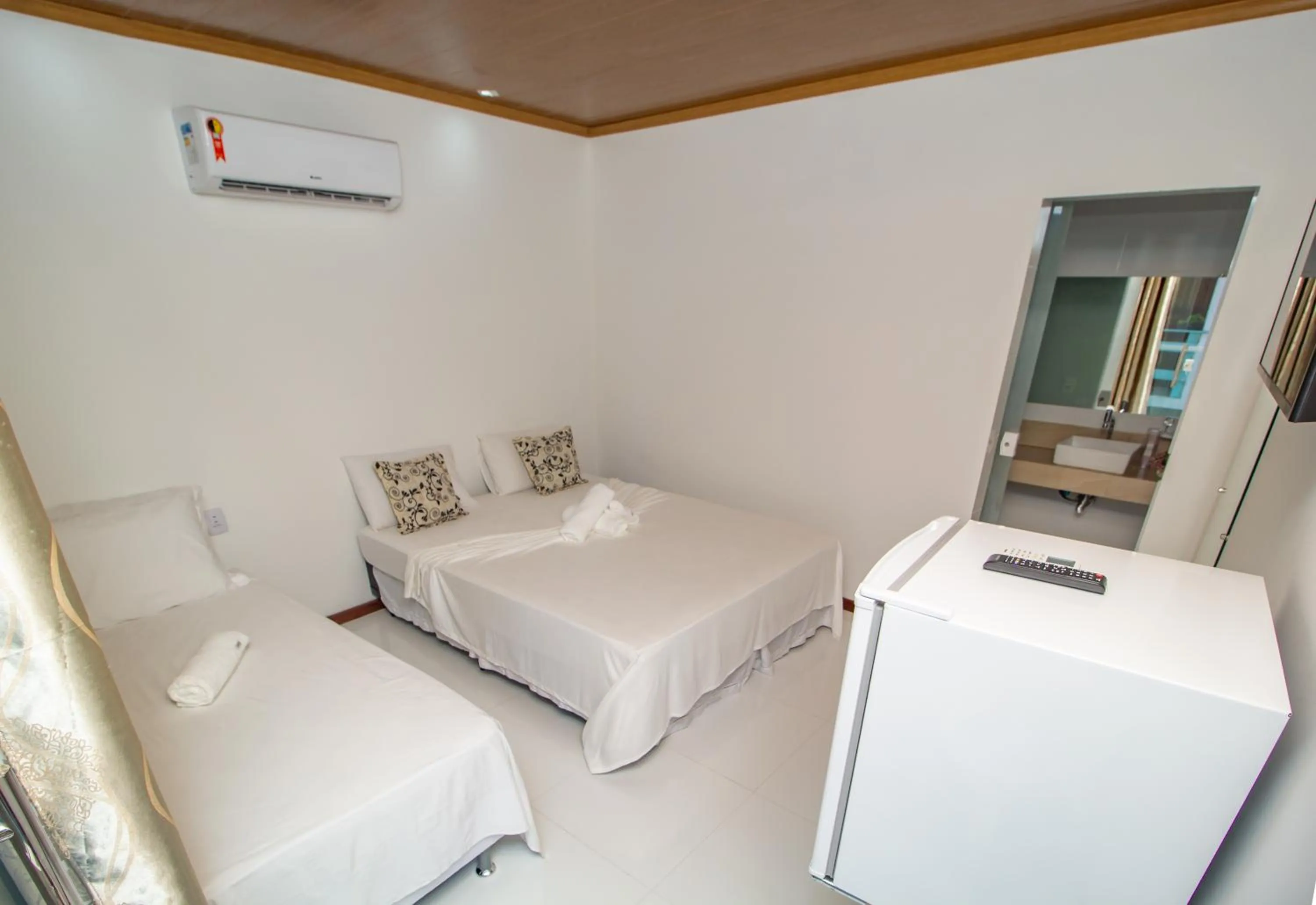 Bed in Pousada Camburi Star