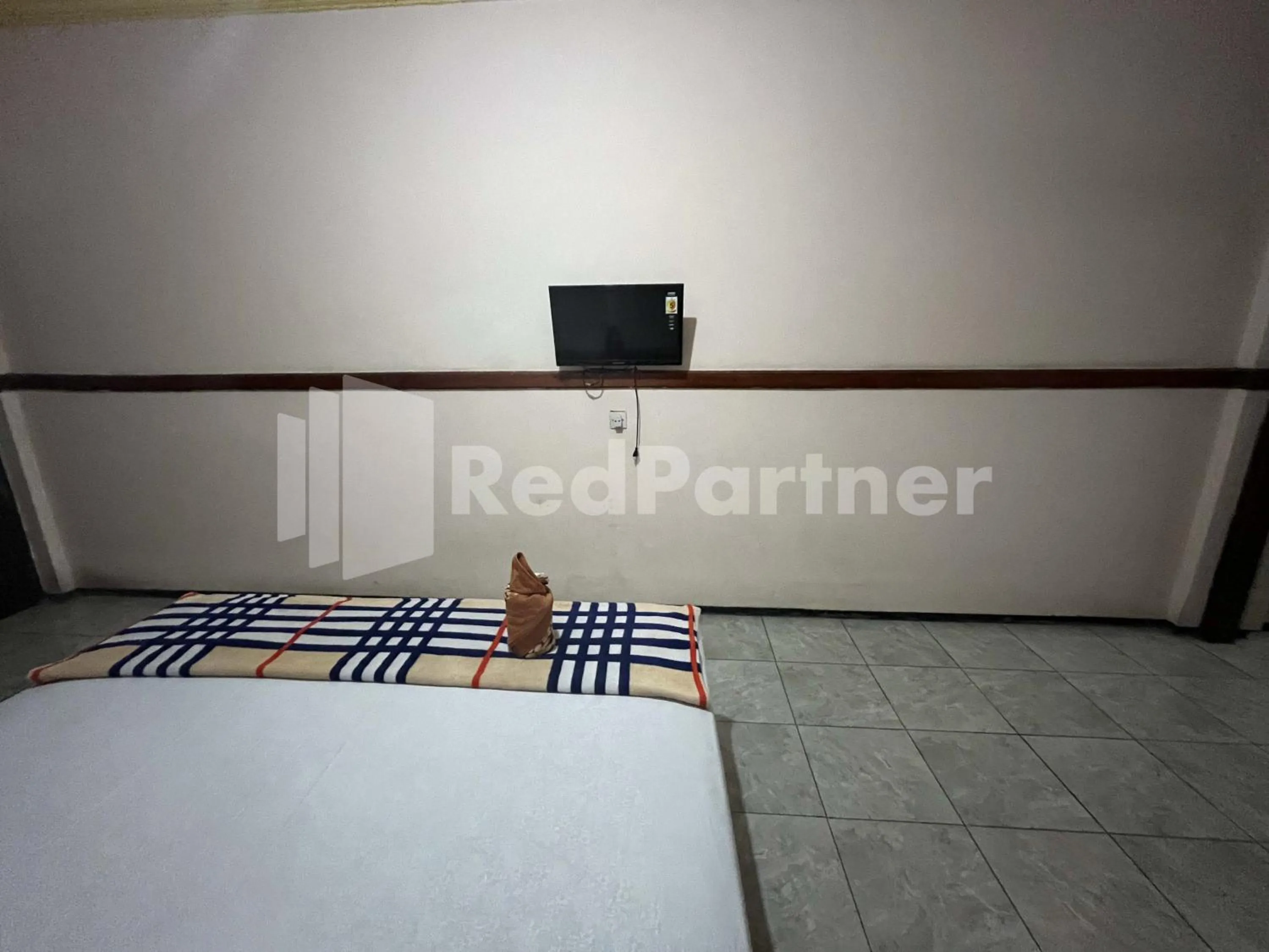 Bedroom, Bed in Hotel Dewi near GOR Merdeka Jombang Mitra RedDoorz