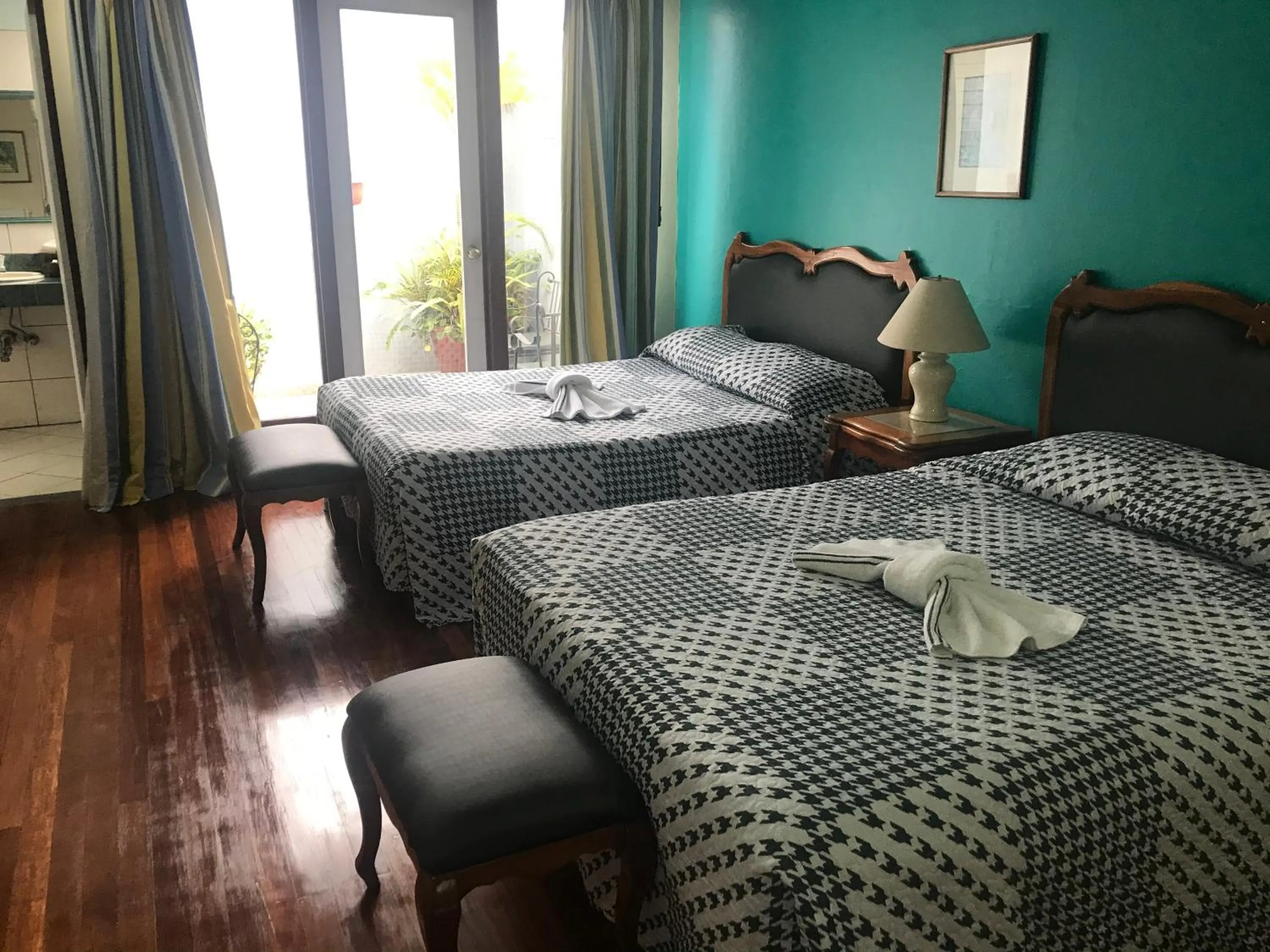 Bed in La Bergerac Boutique Hotel