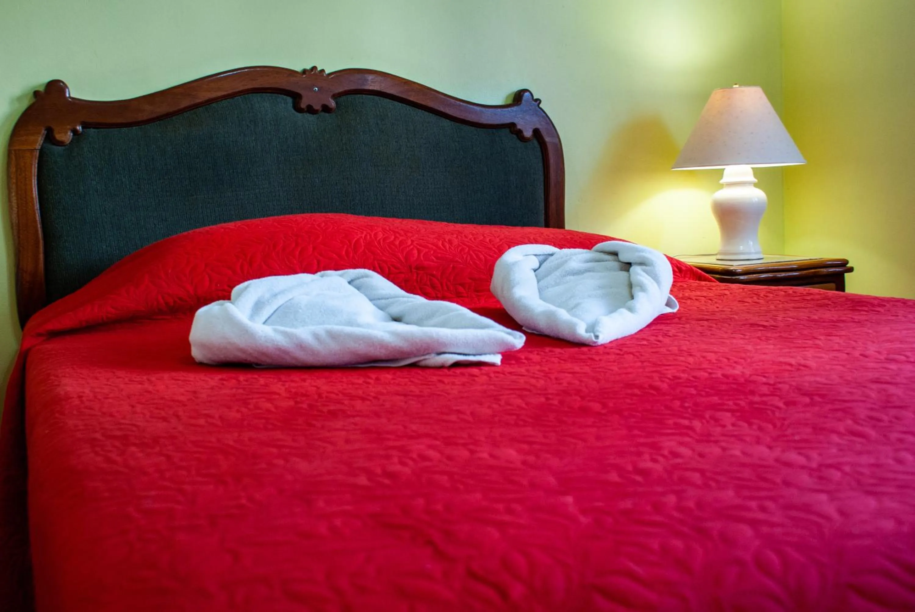 Bed in La Bergerac Boutique Hotel