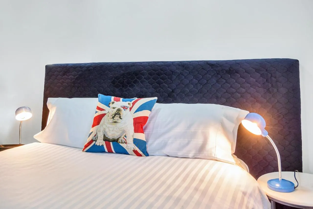 Bed in Roomie Apartment Hotel