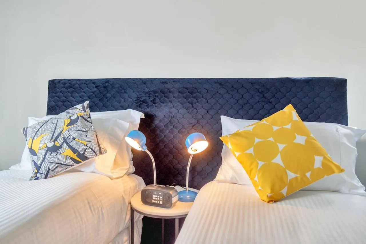 Bed in Roomie Apartment Hotel