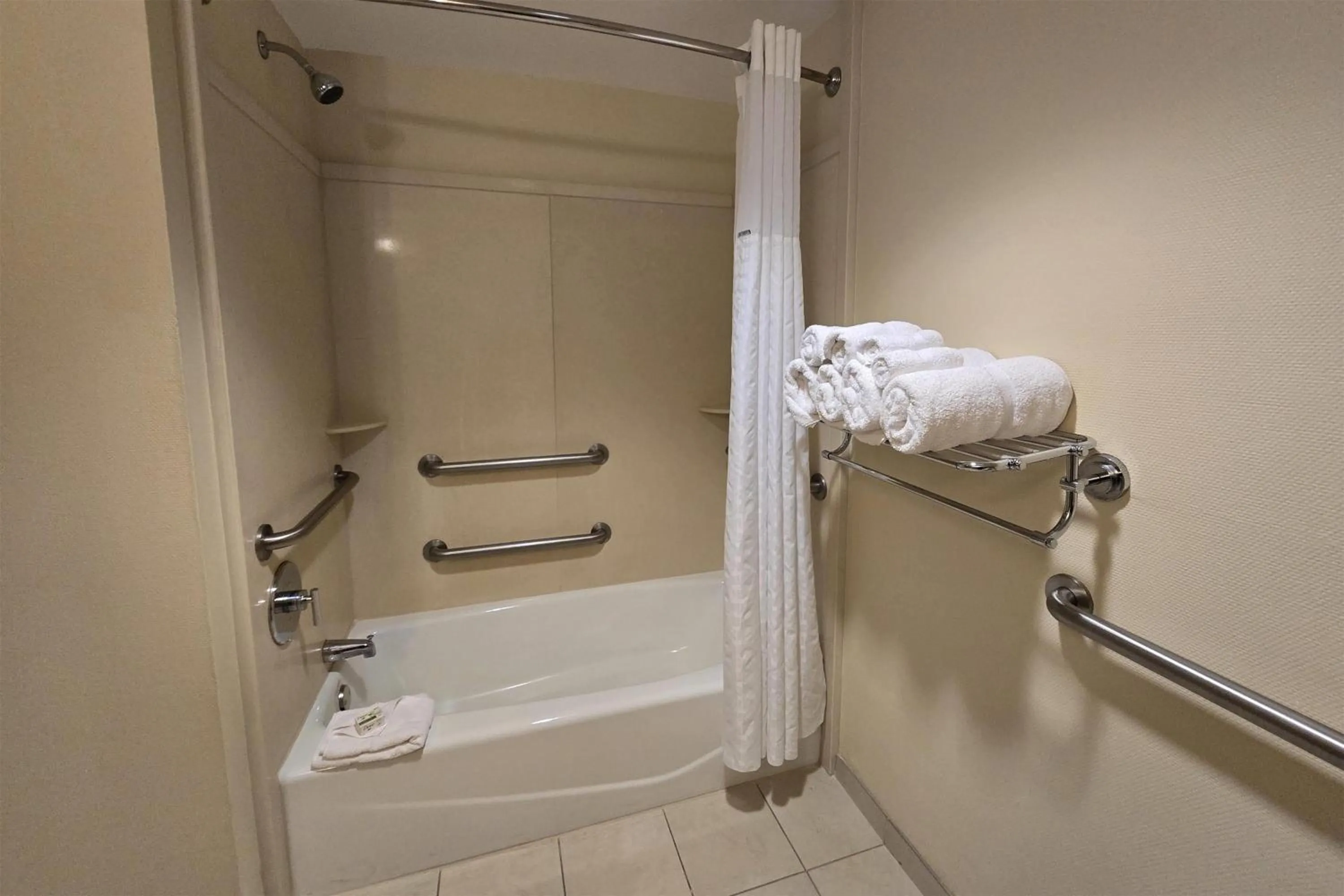 Bathroom in Ramada Plaza by Wyndham Orlando Resort & Suites Intl Drive - Newly Renovated!