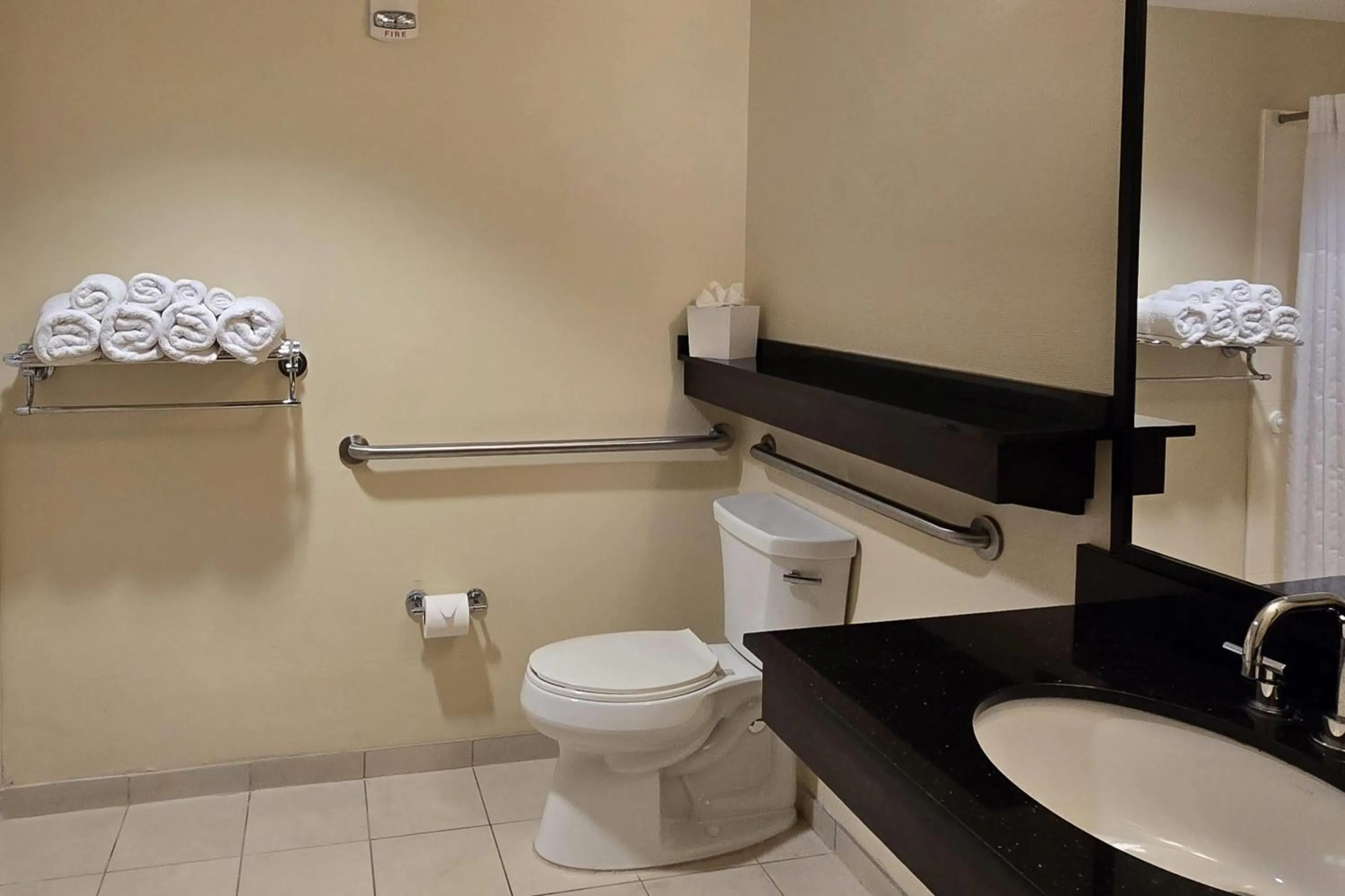 Bathroom in Ramada Plaza by Wyndham Orlando Resort & Suites Intl Drive - Newly Renovated!